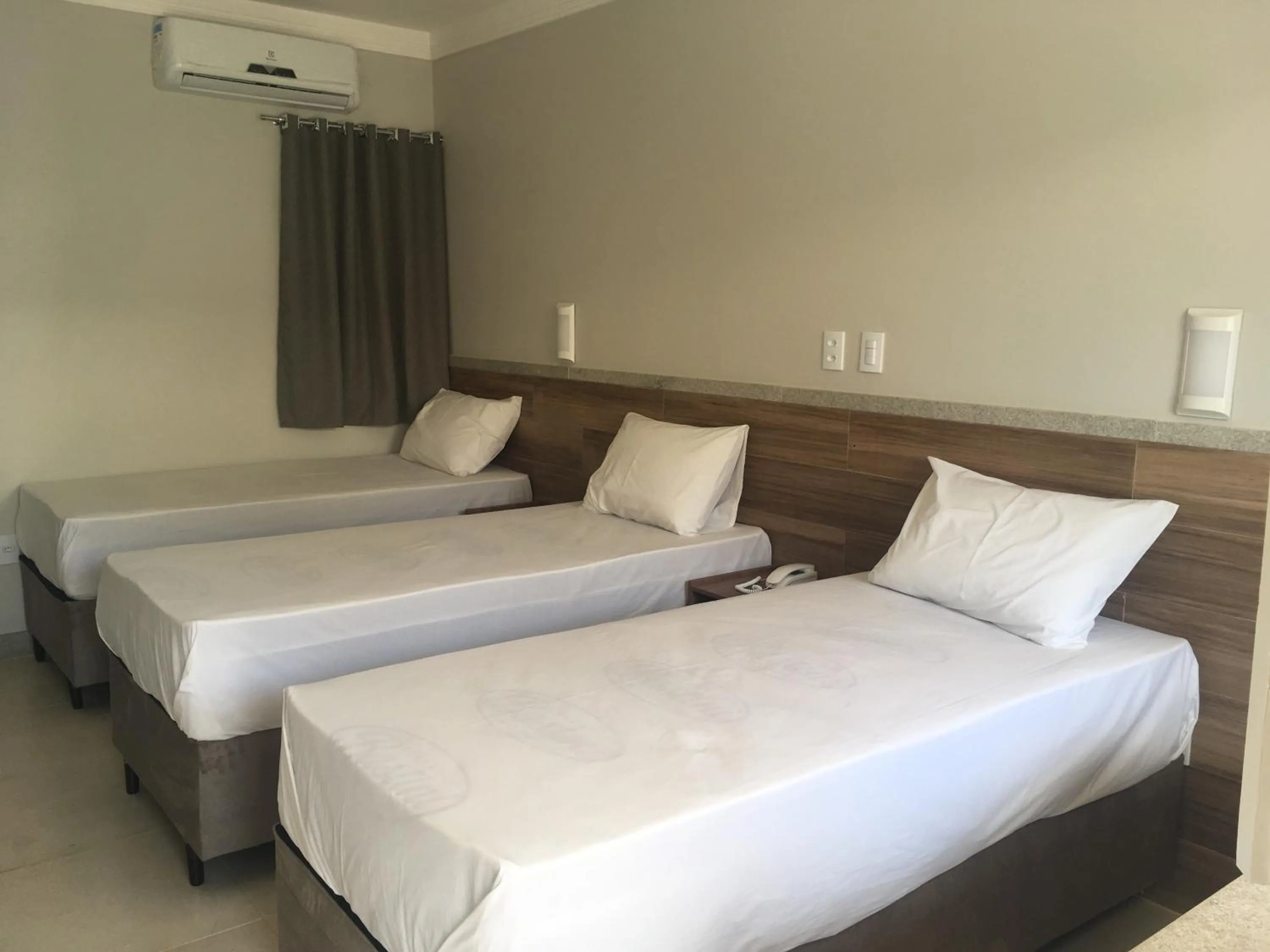 Bed in Tropical Mar Hotel