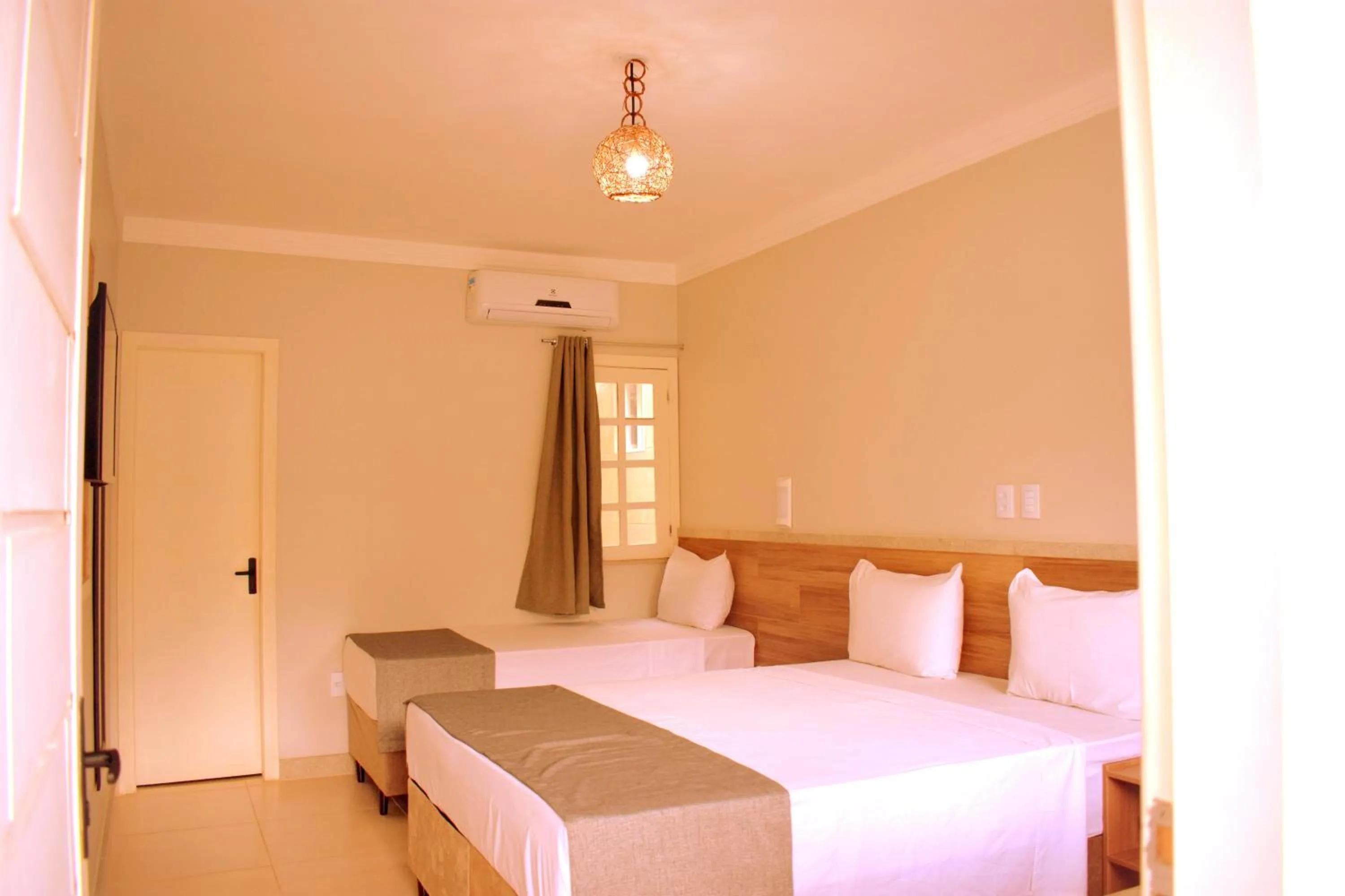 Bed in Tropical Mar Hotel