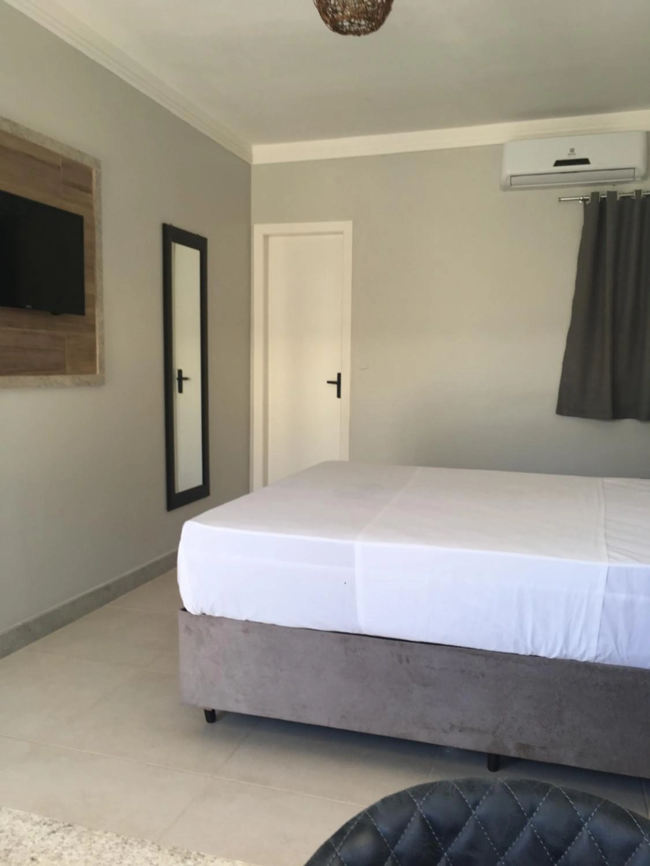 Bed in Tropical Mar Hotel