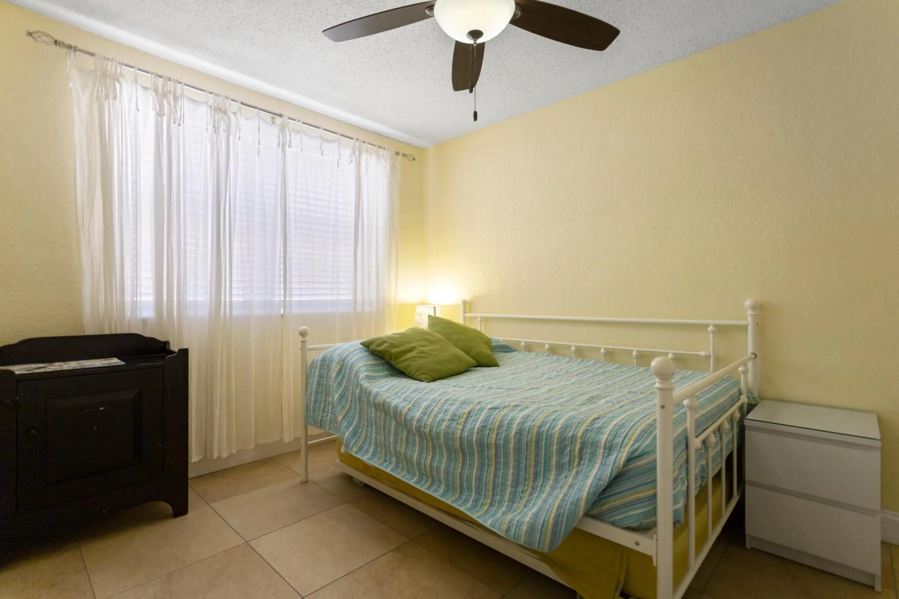 Bed in Gulf Winds Resort by Travel Resort Services