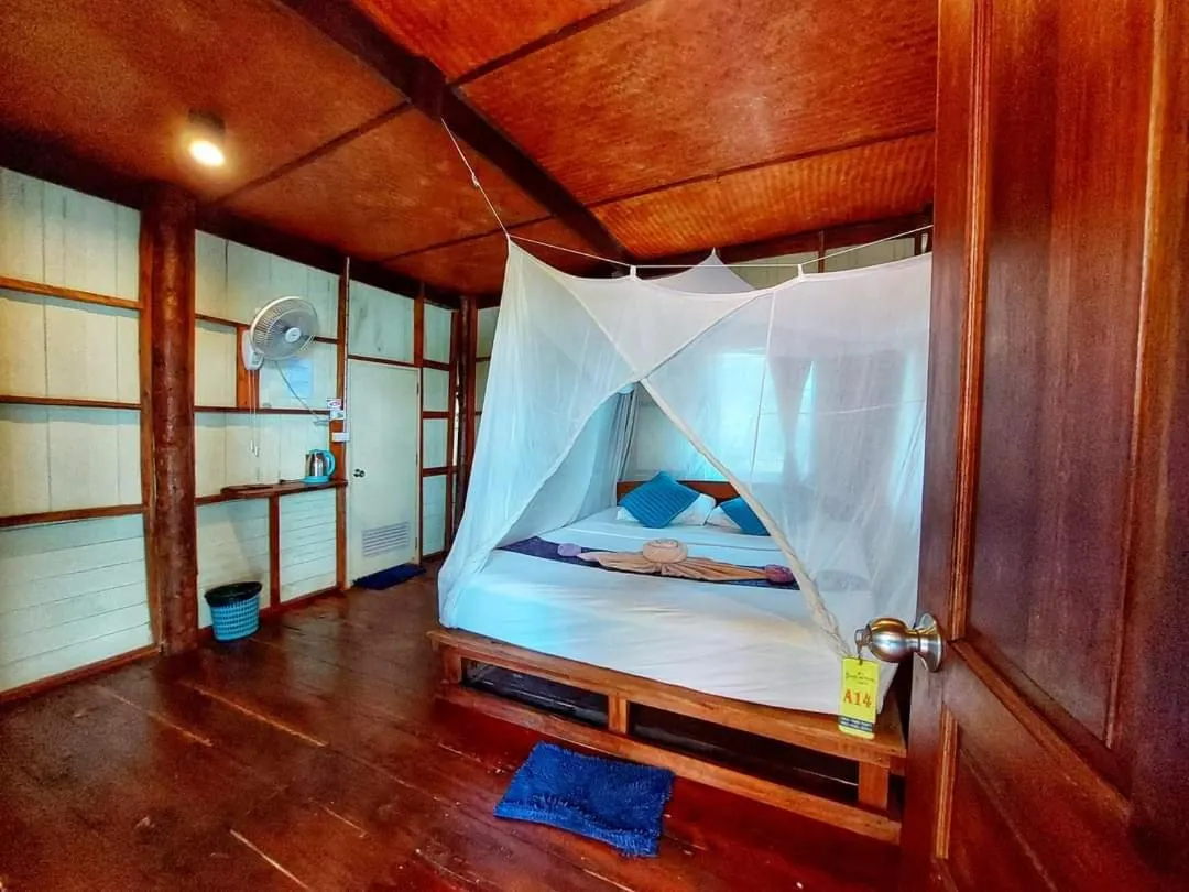 Bed in Jungle Hill Beach Bungalow