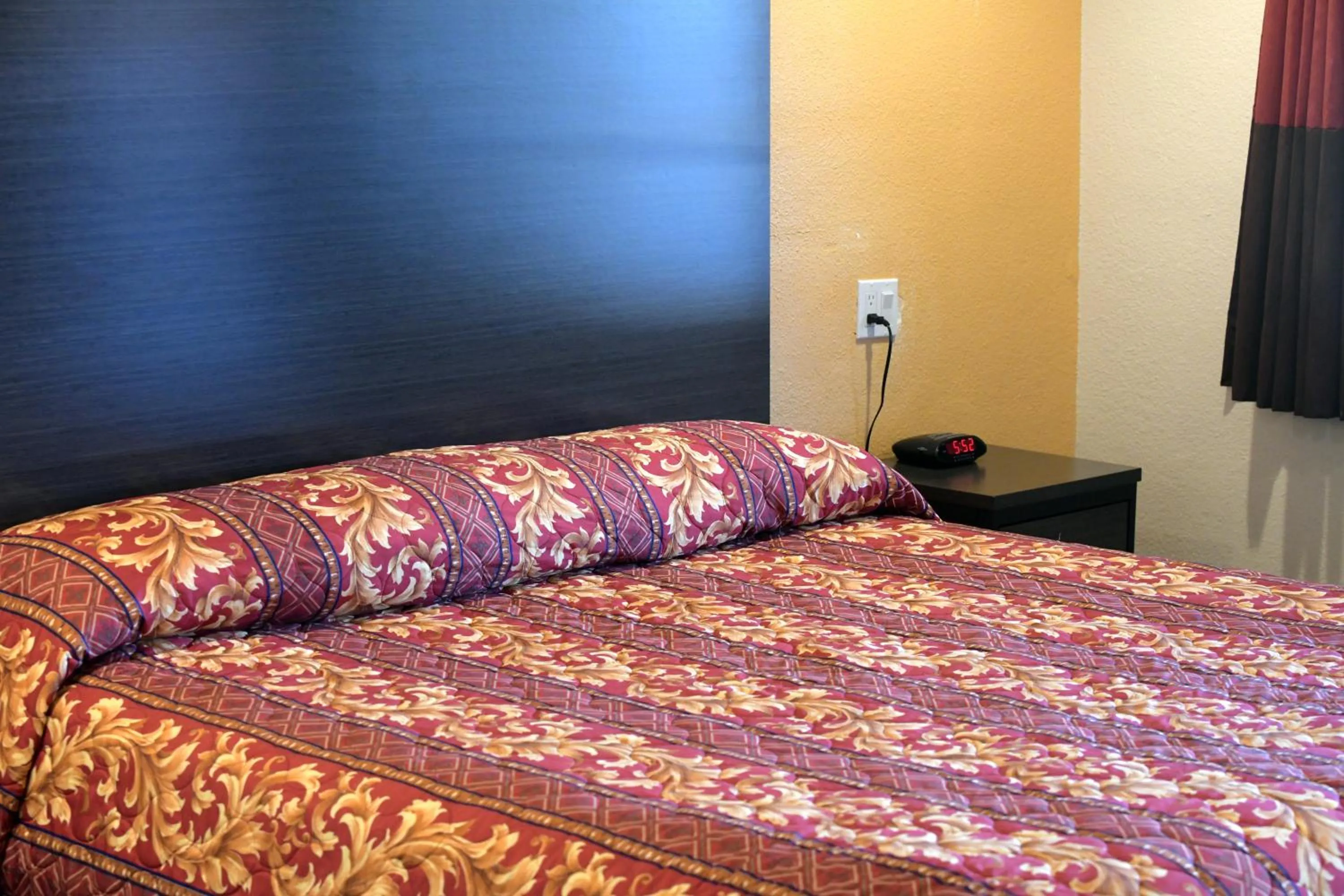 Bed in A-1 Budget Motel