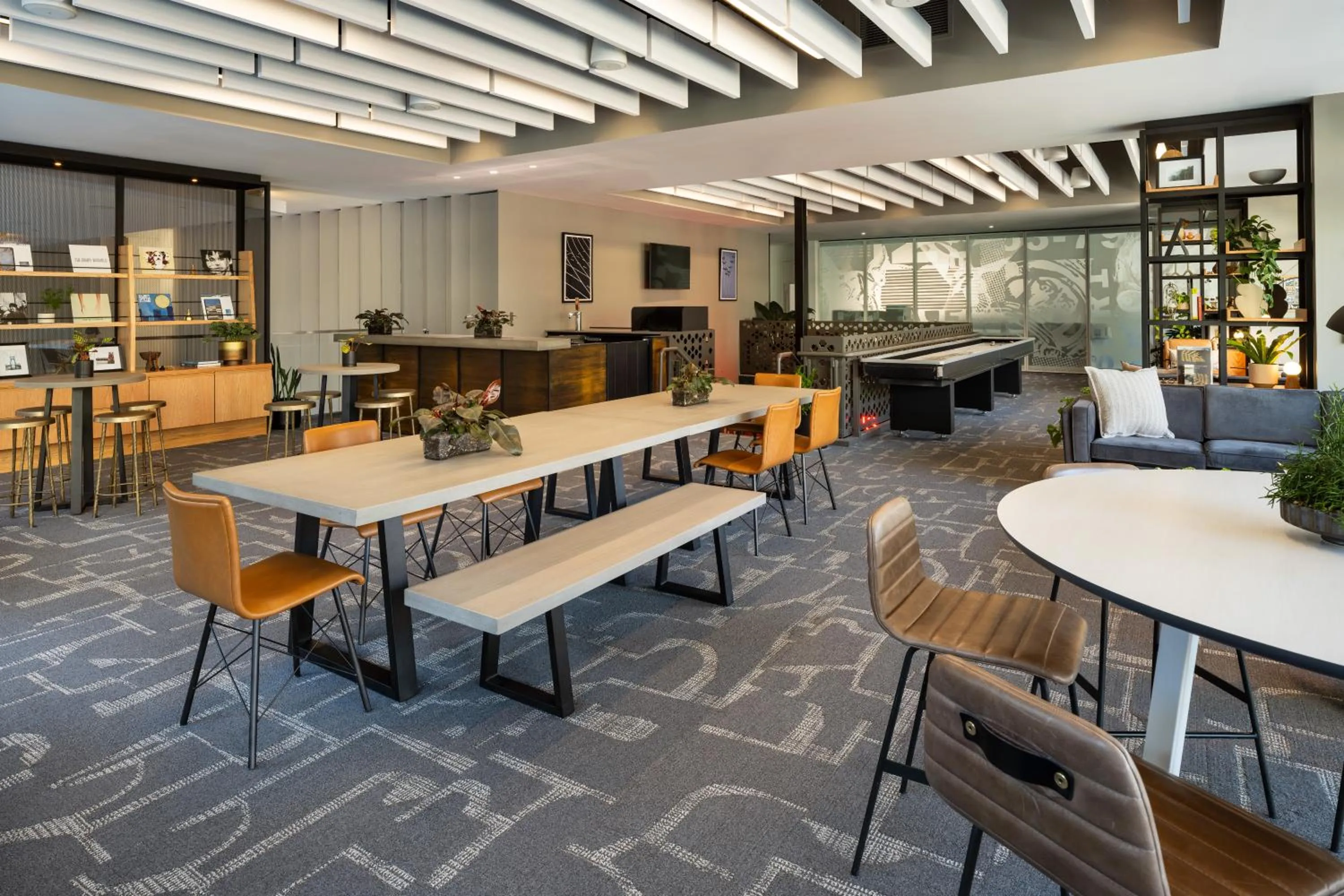 Communal lounge/ TV room in Hotel Vance, Portland, a Tribute Portfolio Hotel