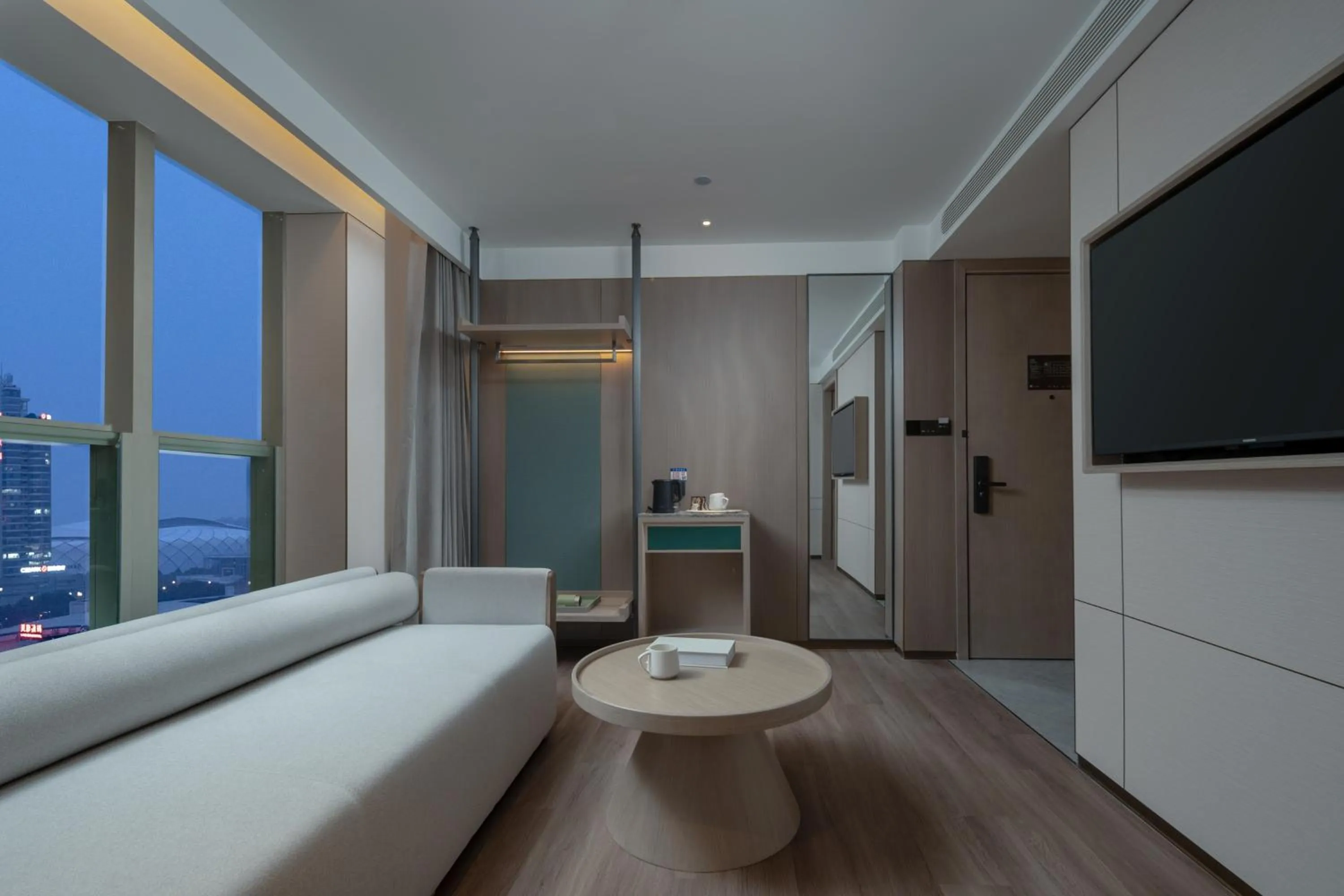 Communal lounge/ TV room in Manju Hotel Shaoxing Keqiao Wanda