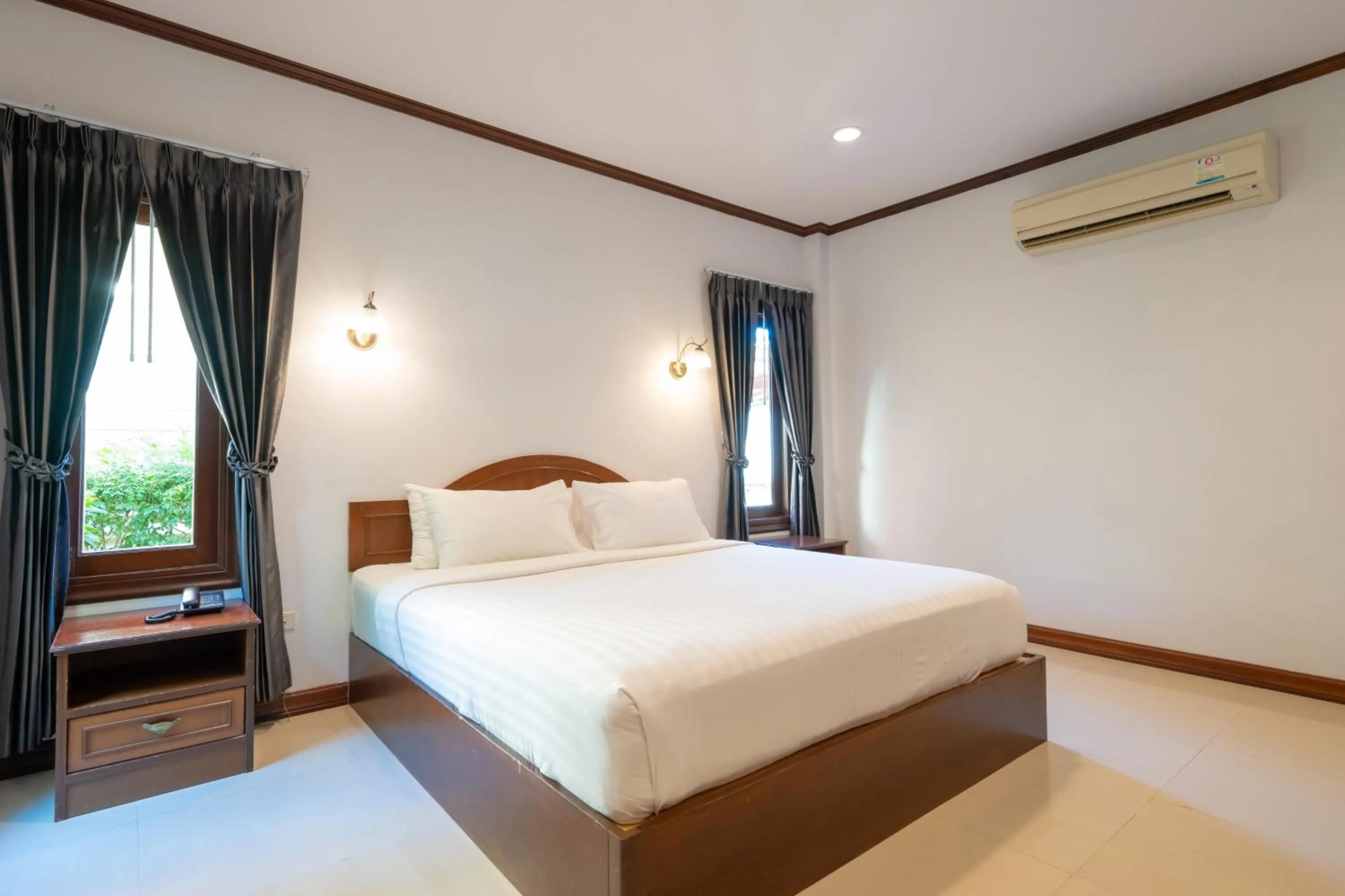 Bed in The Green Beach Resort