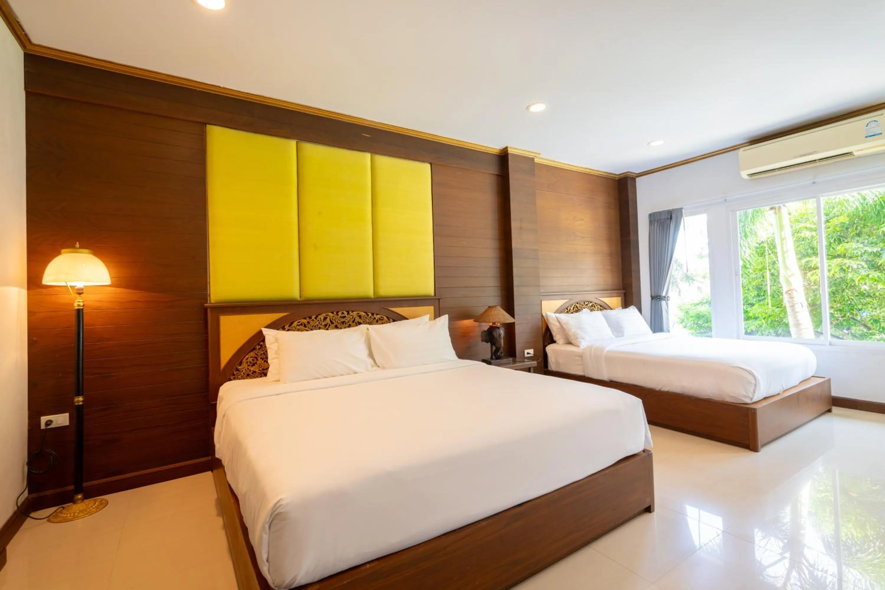 Bed in The Green Beach Resort