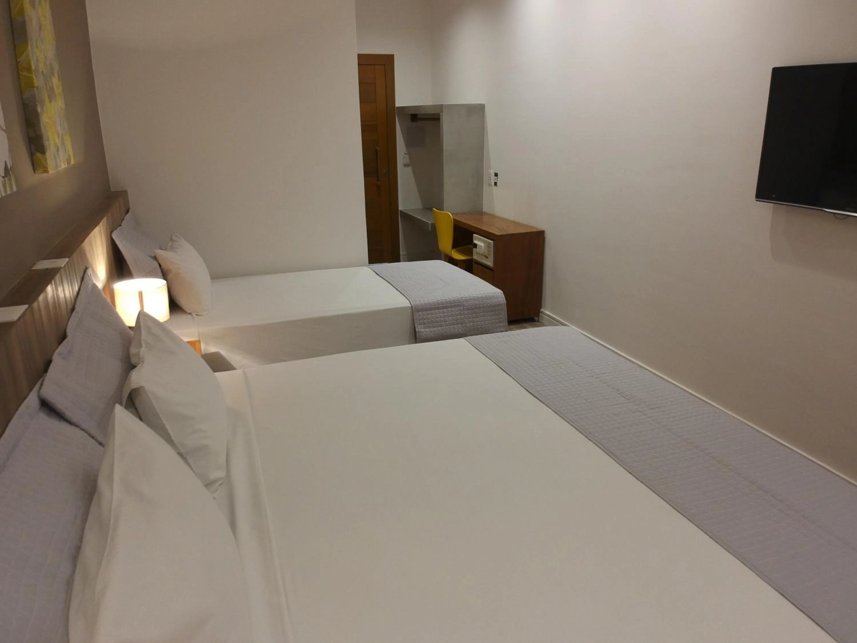 Bed in Carambola Hotel