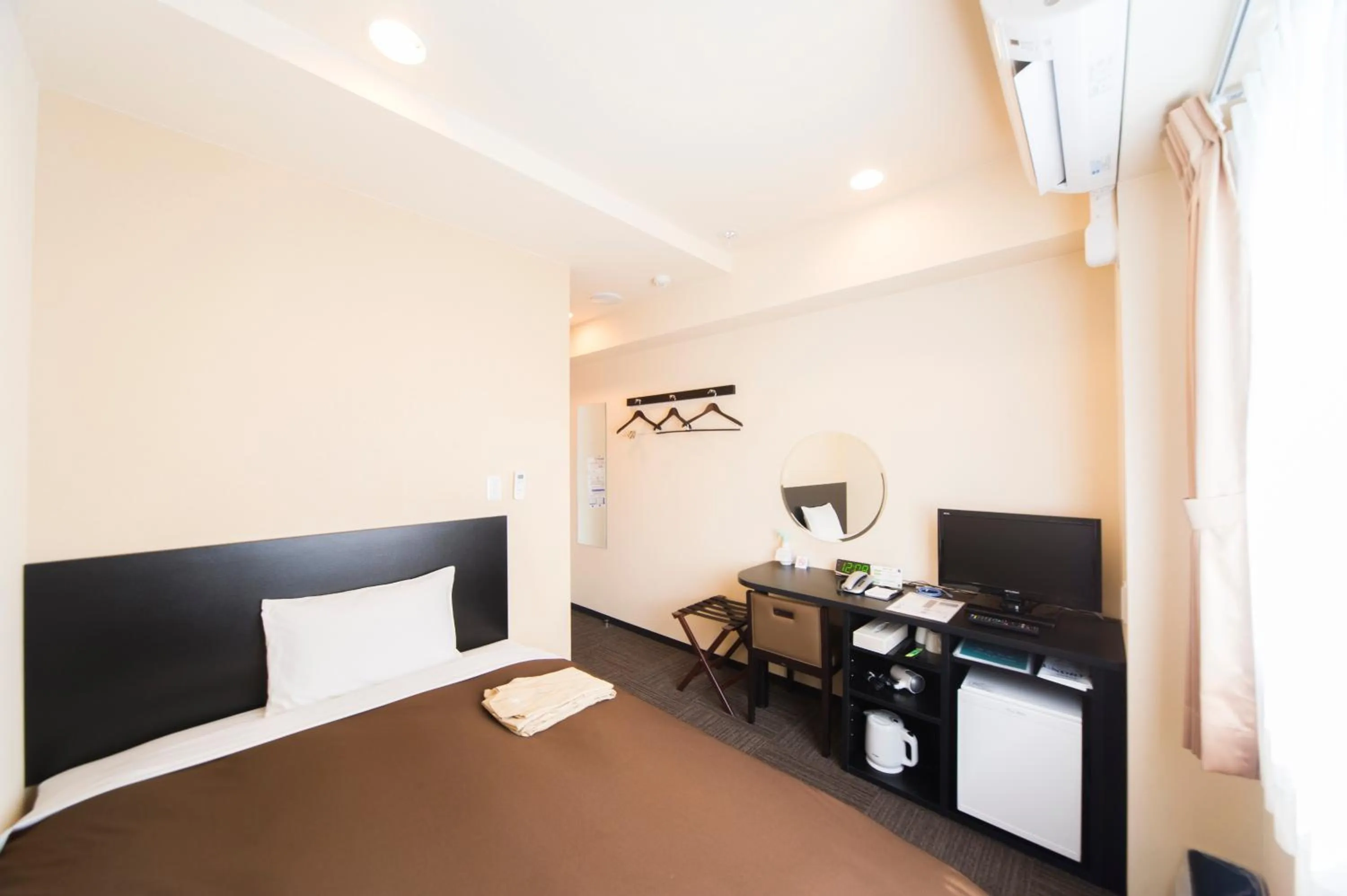 Photo of the whole room, Bed in Urbain Hiroshima Central