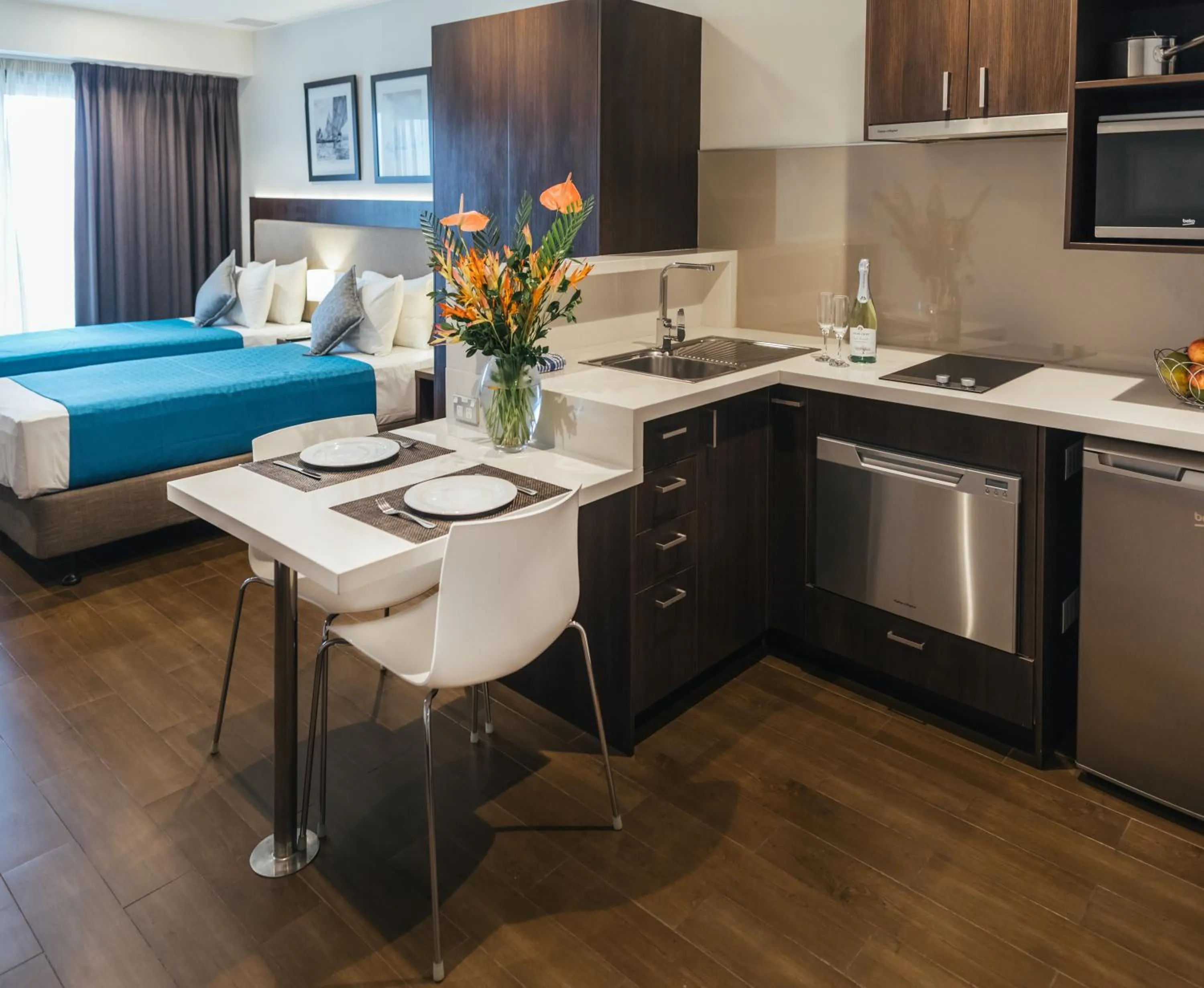 Dining area, Bed in Quest Suva