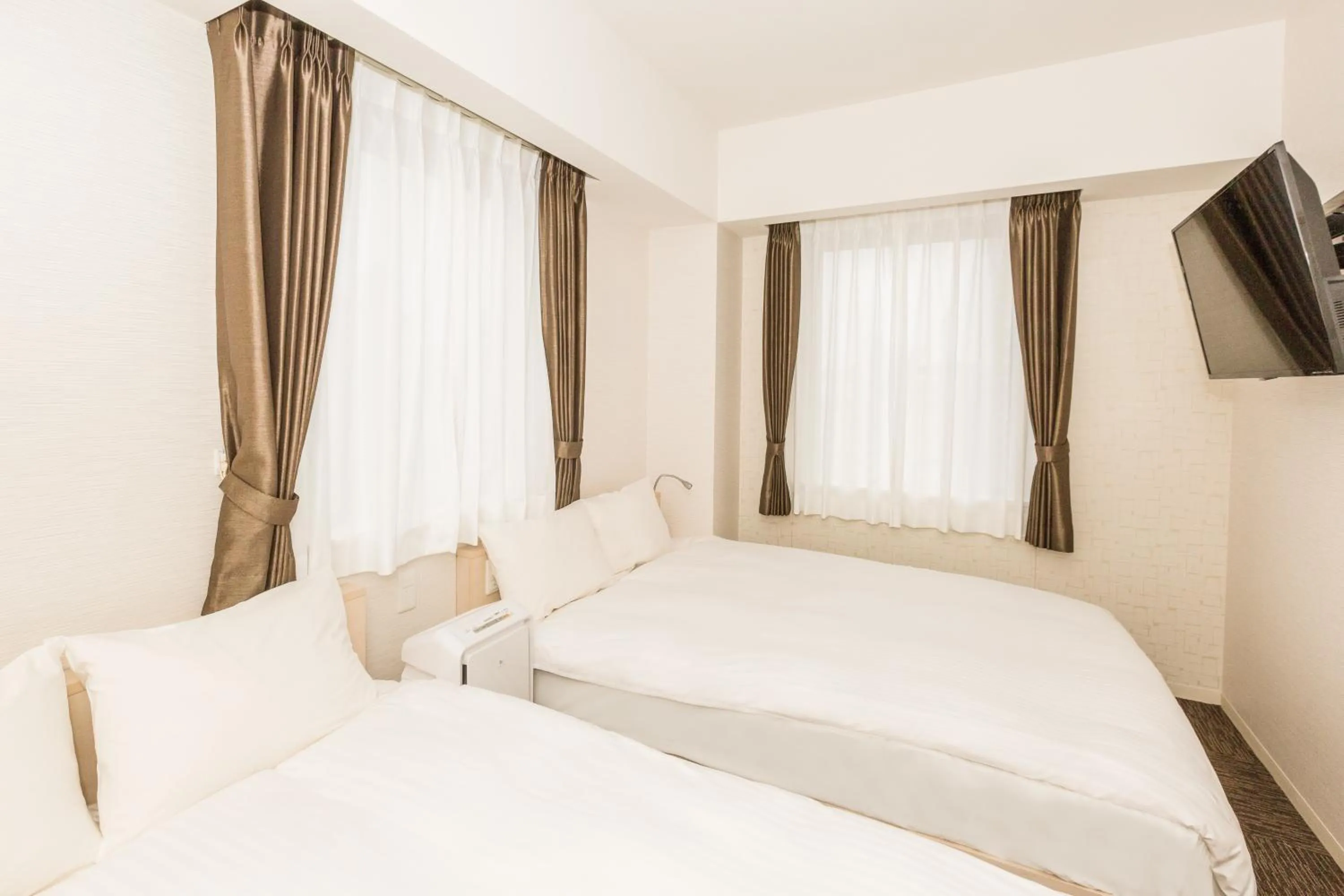 Photo of the whole room, Bed in EIWA PLACE HOTEL Hakata