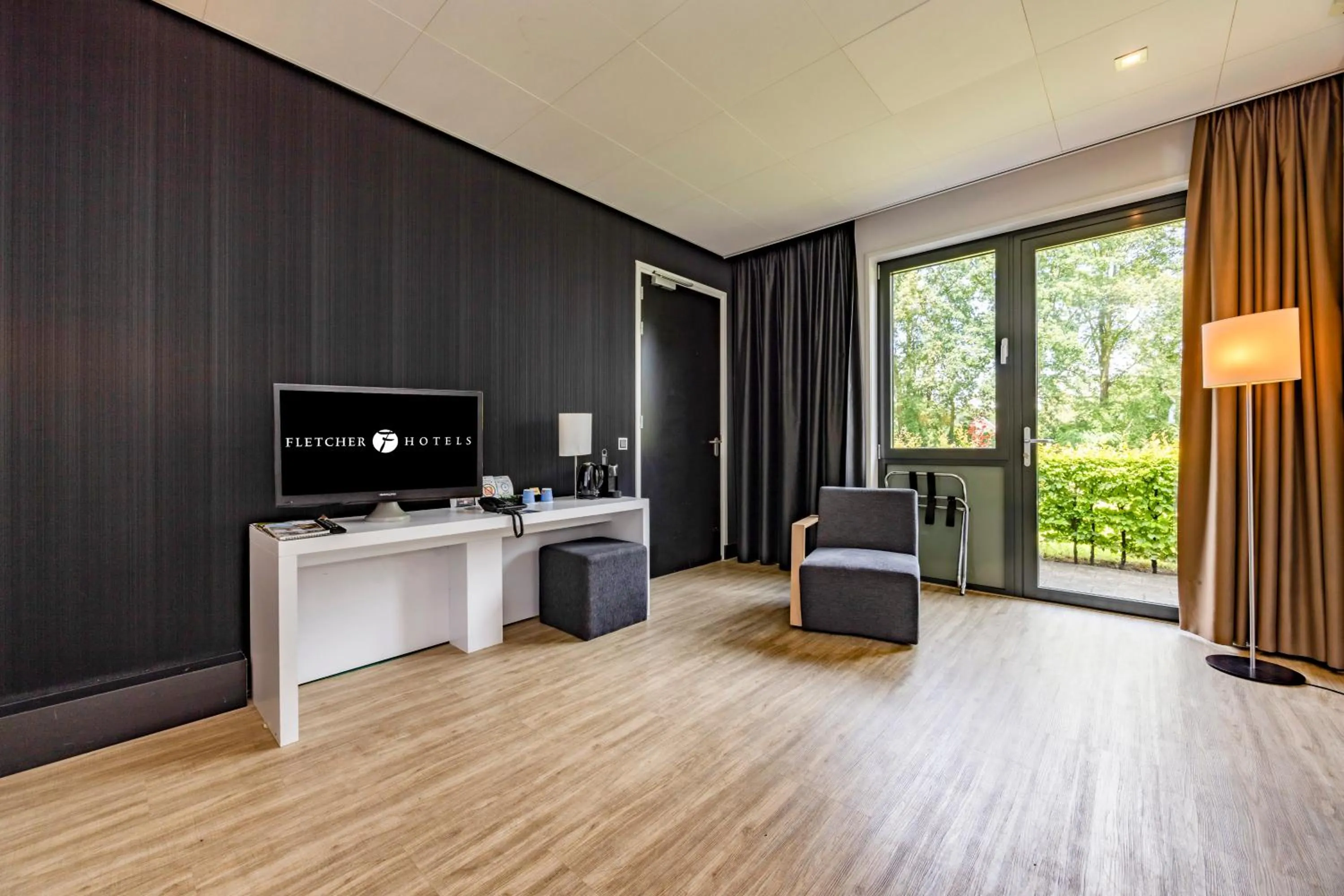 Seating area in Fletcher Hotel-Restaurant Teugel Uden-Veghel