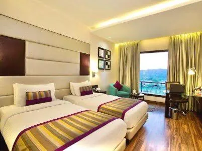 Photo of the whole room, Bed in Golden Tulip Chandigarh, Panchkula