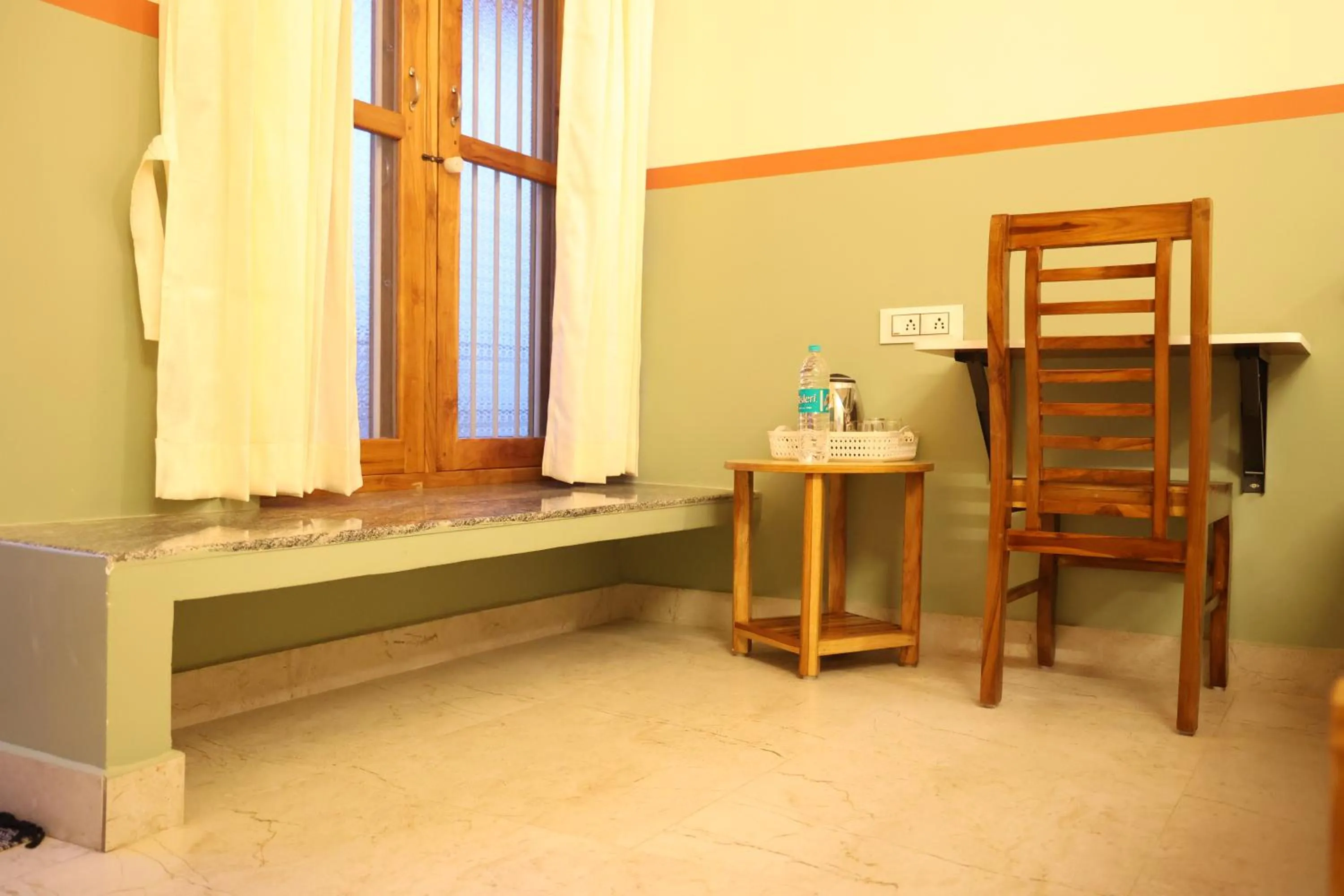 Seating area, Bed in Dwaraka Guest House