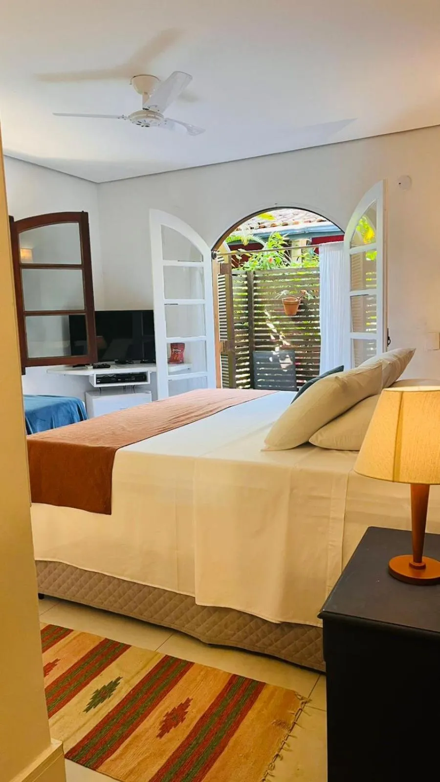 Bed in Pousada Canto do Camburi