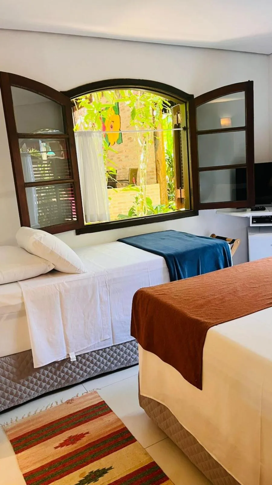 Bed in Pousada Canto do Camburi