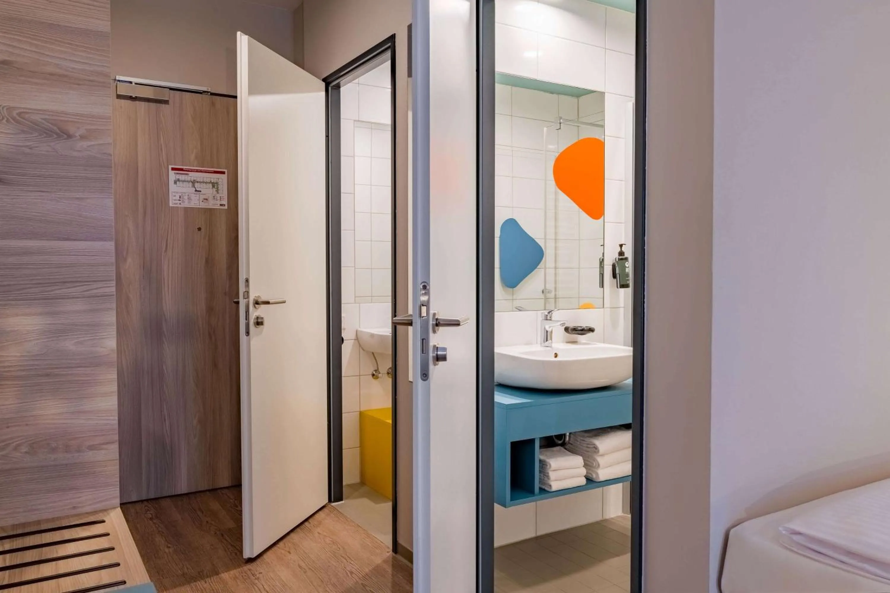 Bathroom, Bed in Ramada Encore by Wyndham Munich Messe