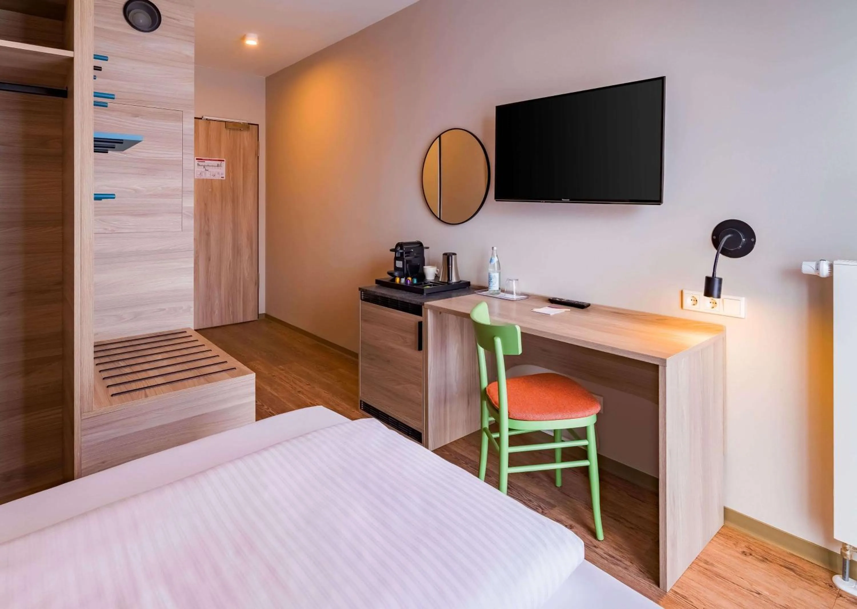 Photo of the whole room, Bed in Ramada Encore by Wyndham Munich Messe