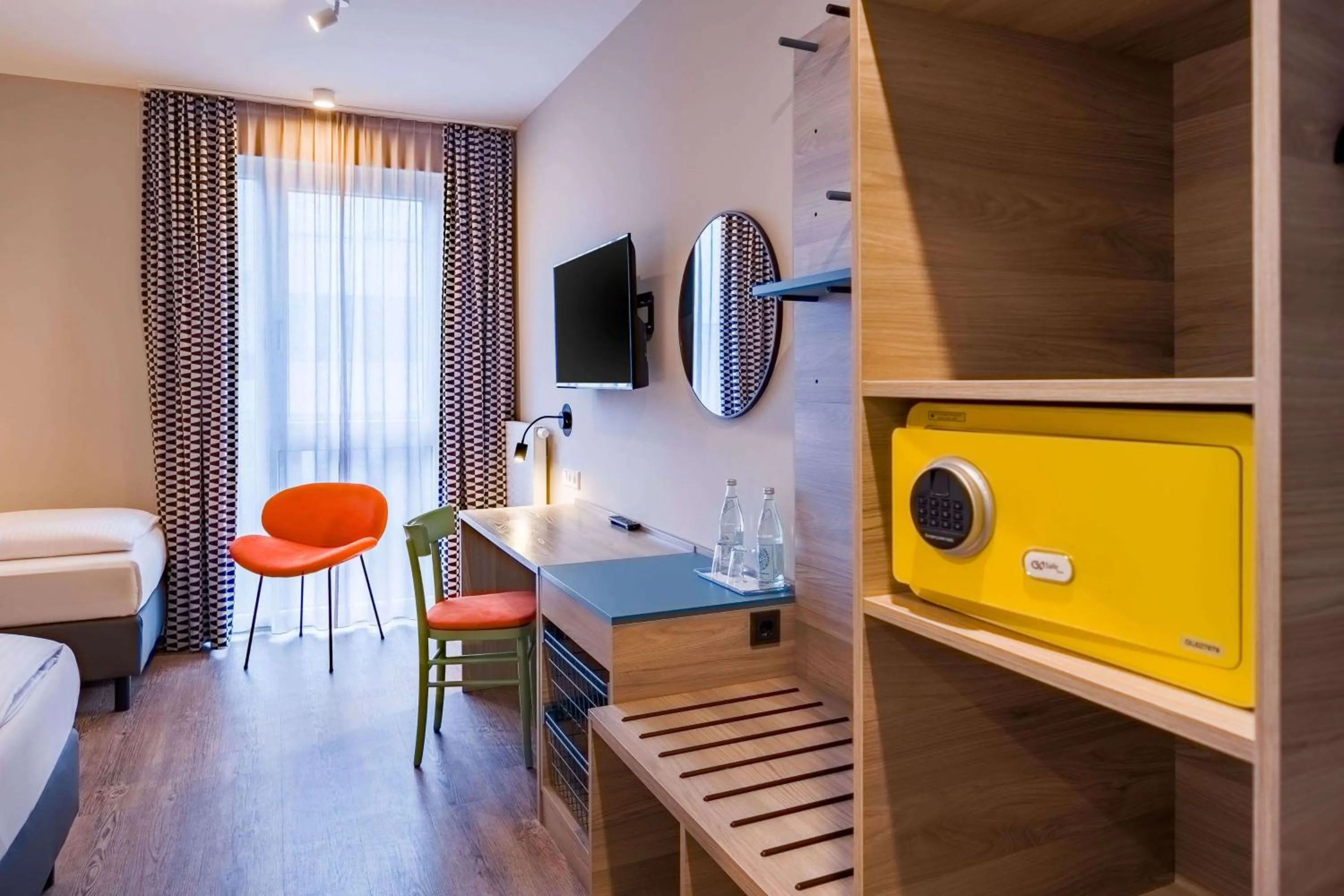 Photo of the whole room, Bed in Ramada Encore by Wyndham Munich Messe