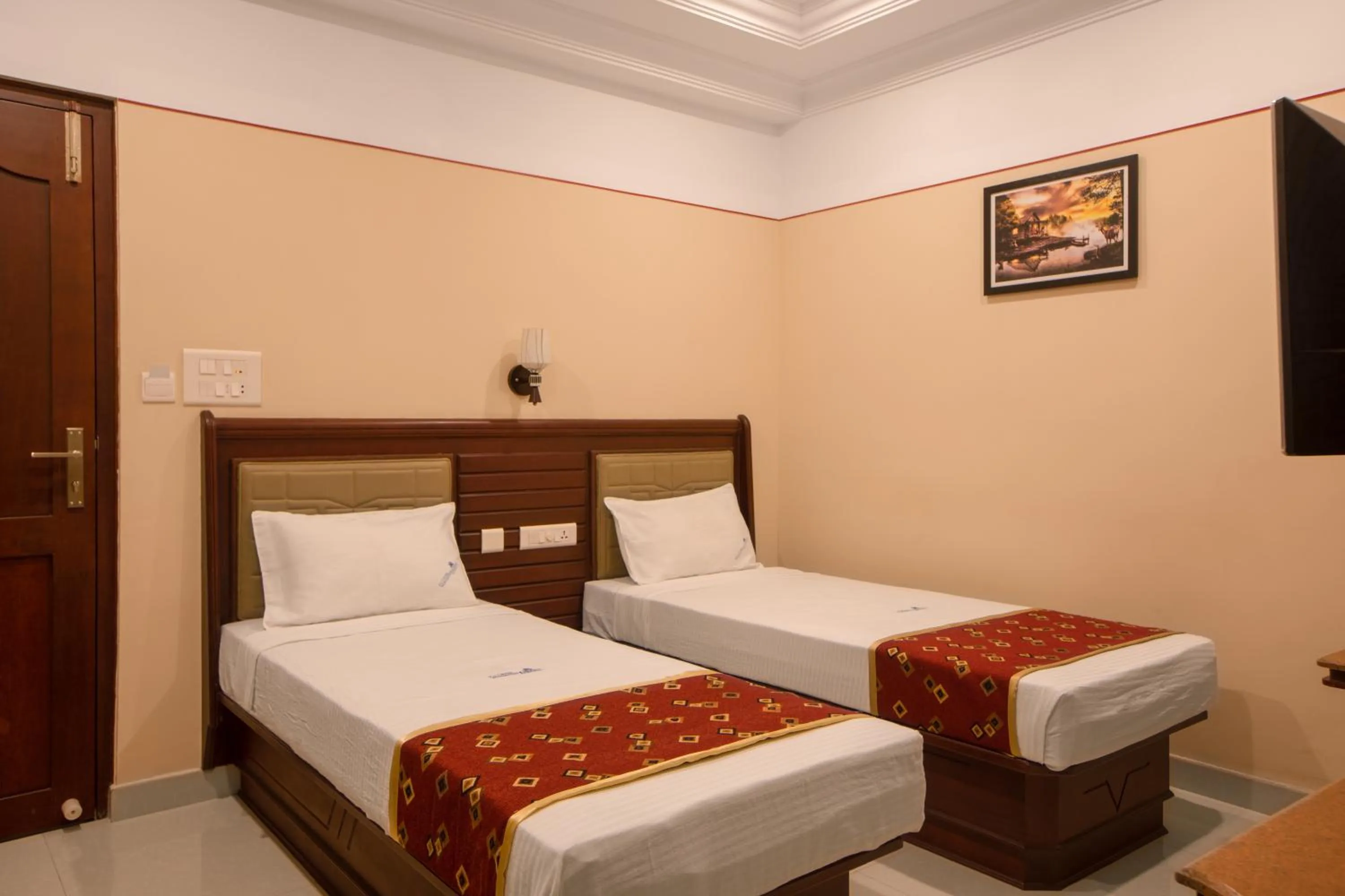 Bed in Hotel Vashanth Krishna