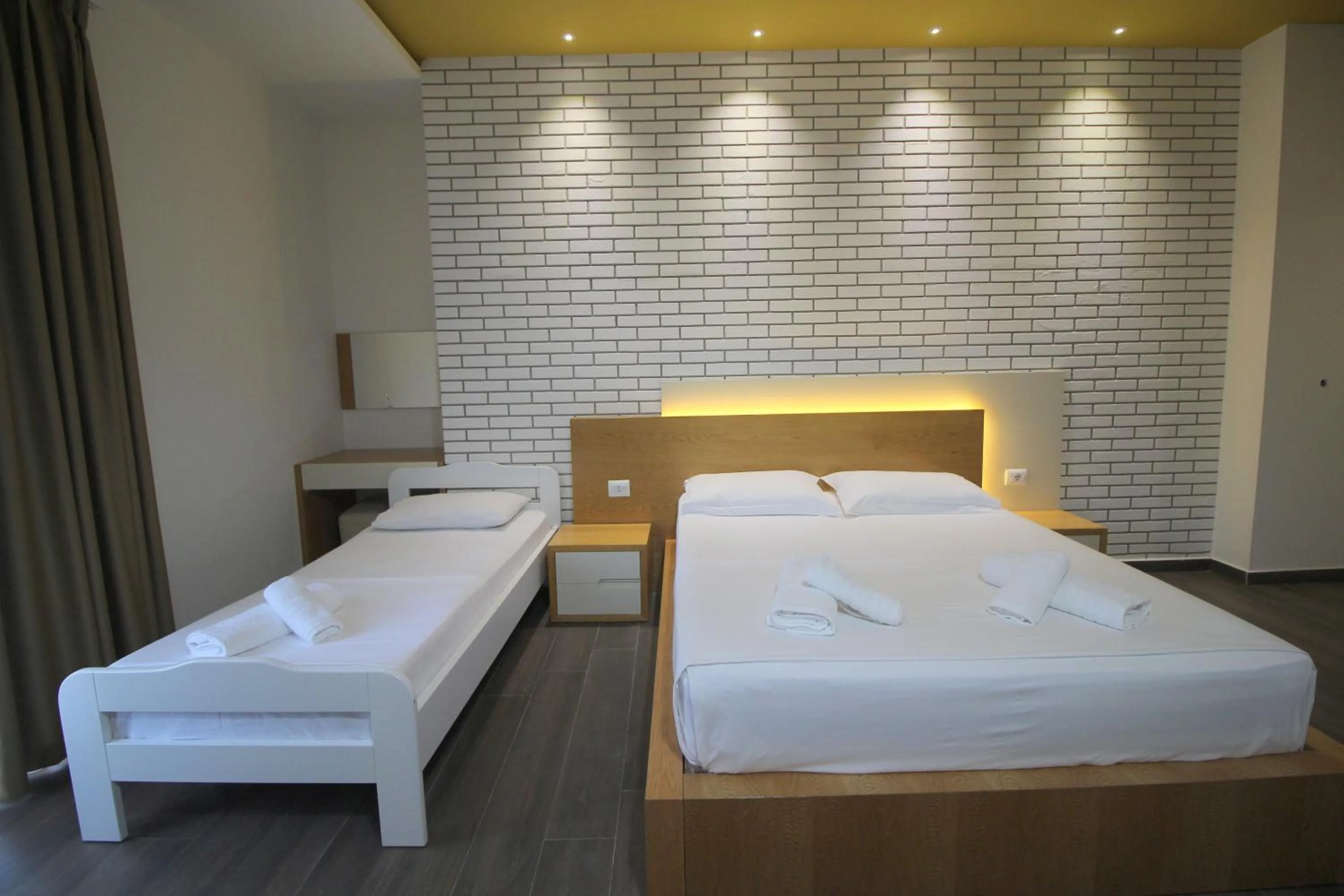 Bed in Sunrise Luxury Apartments