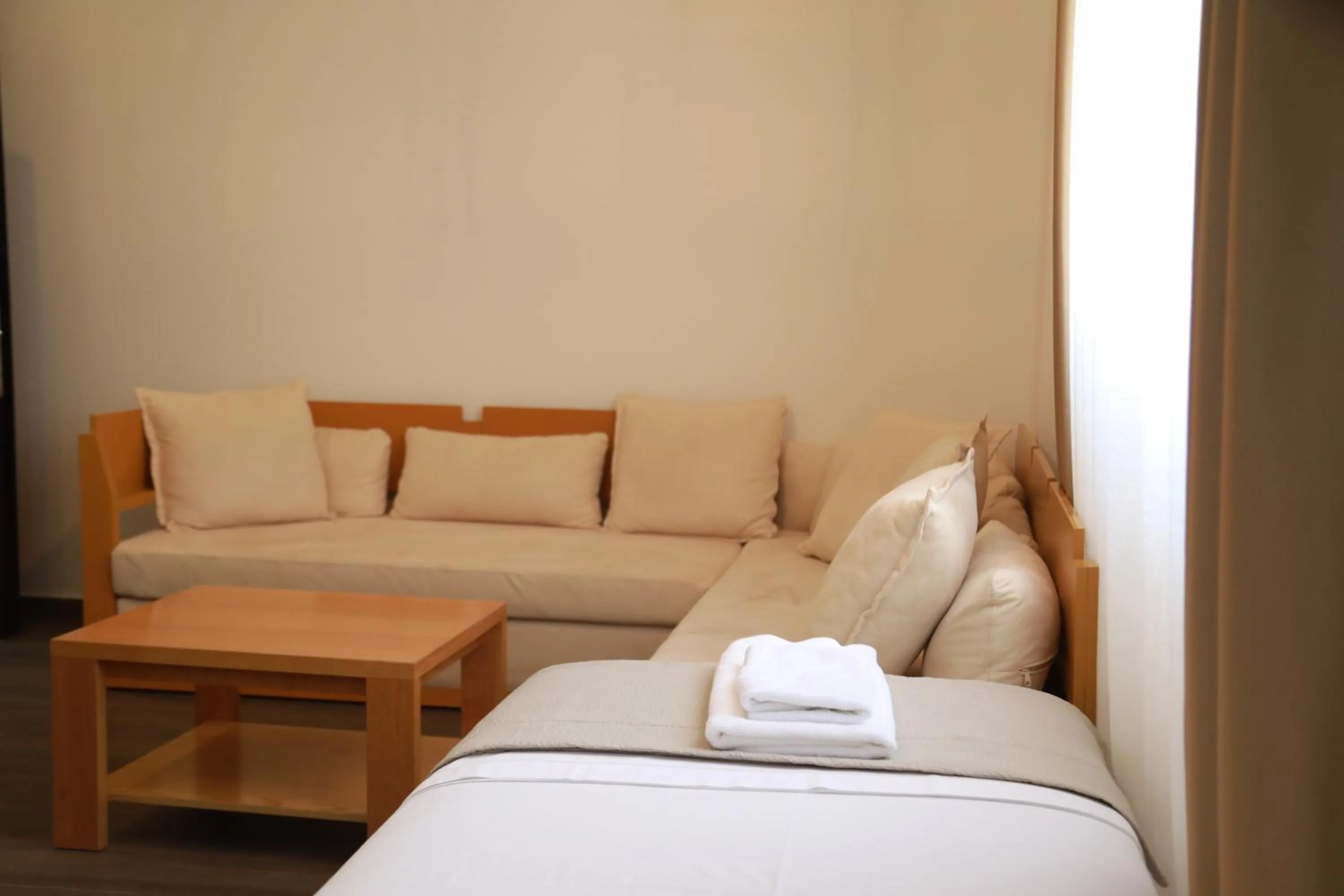 Bed in Sunrise Luxury Apartments