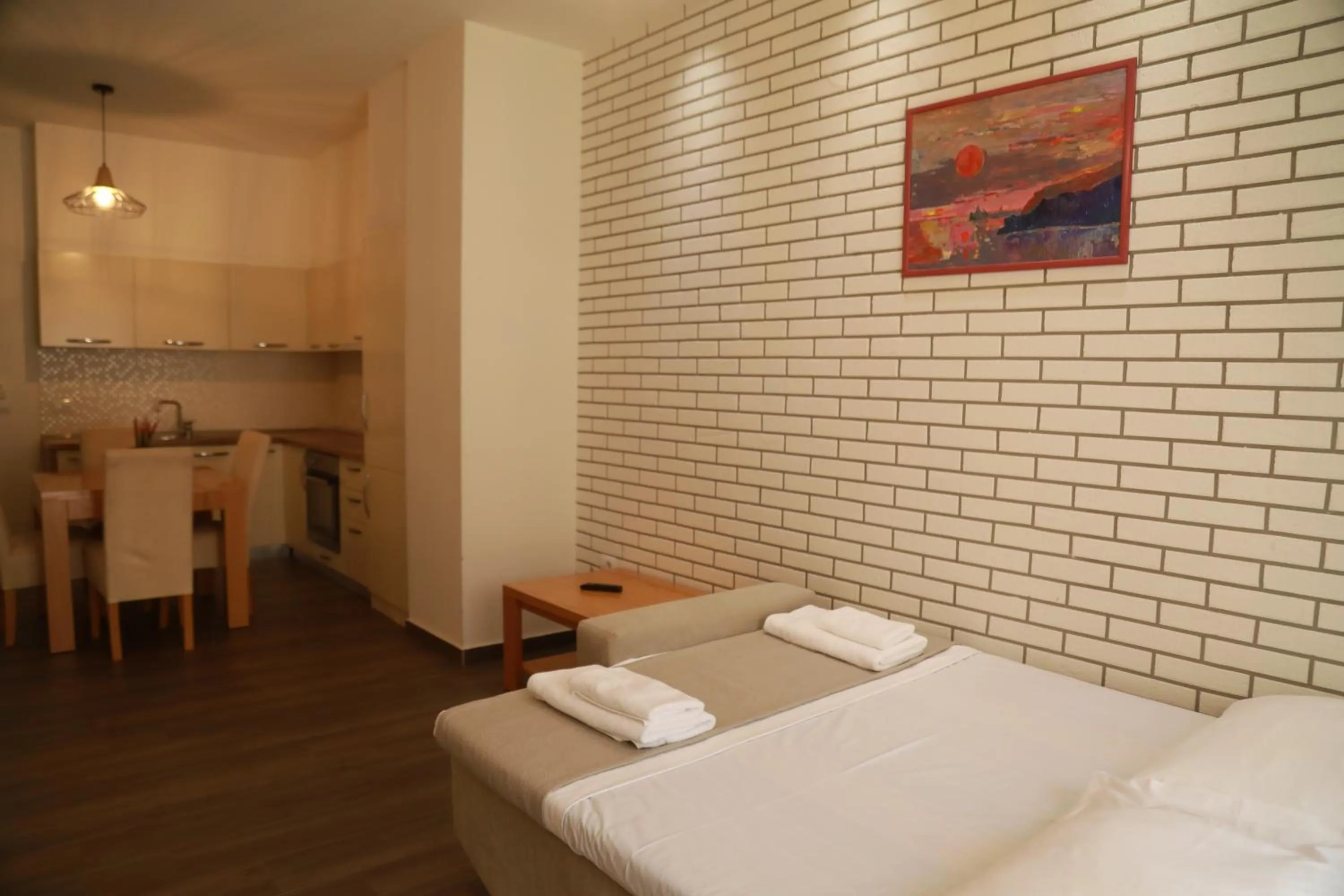 Bed in Sunrise Luxury Apartments