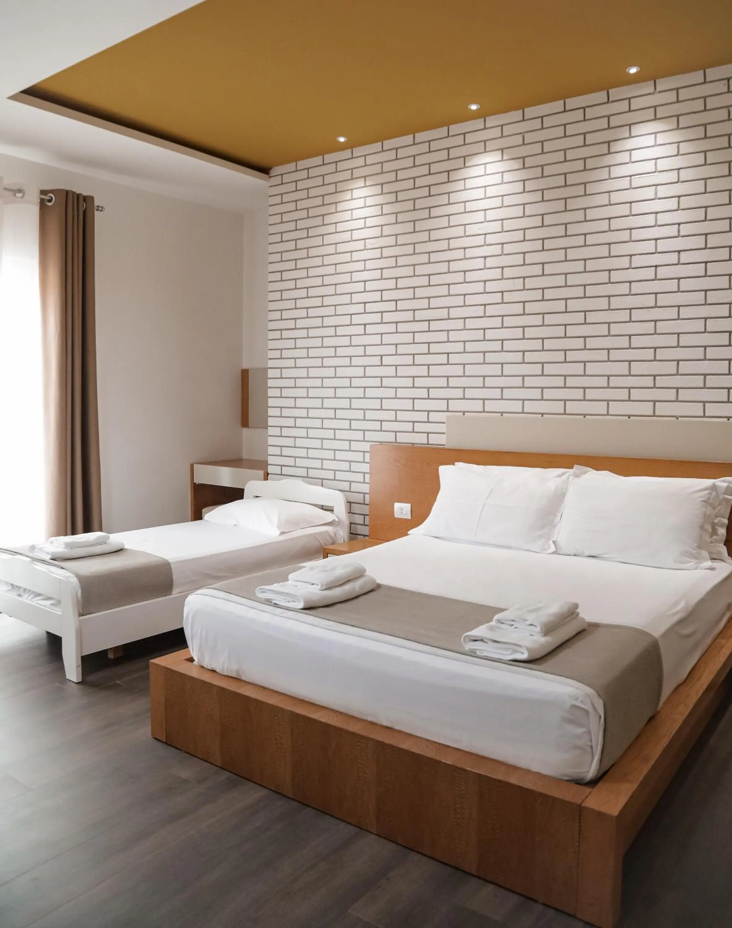 Bed in Sunrise Luxury Apartments