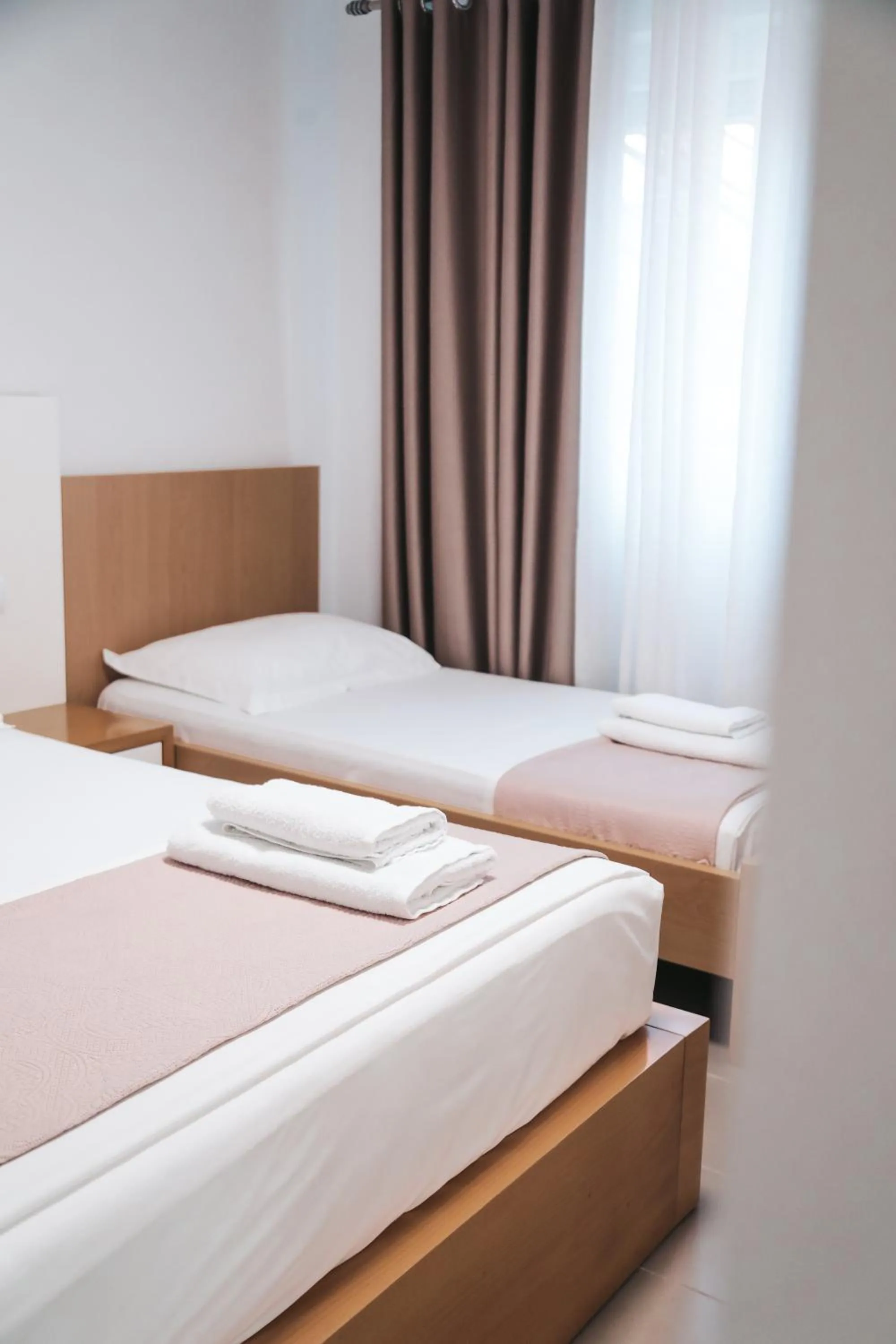 Bed in Sunrise Luxury Apartments