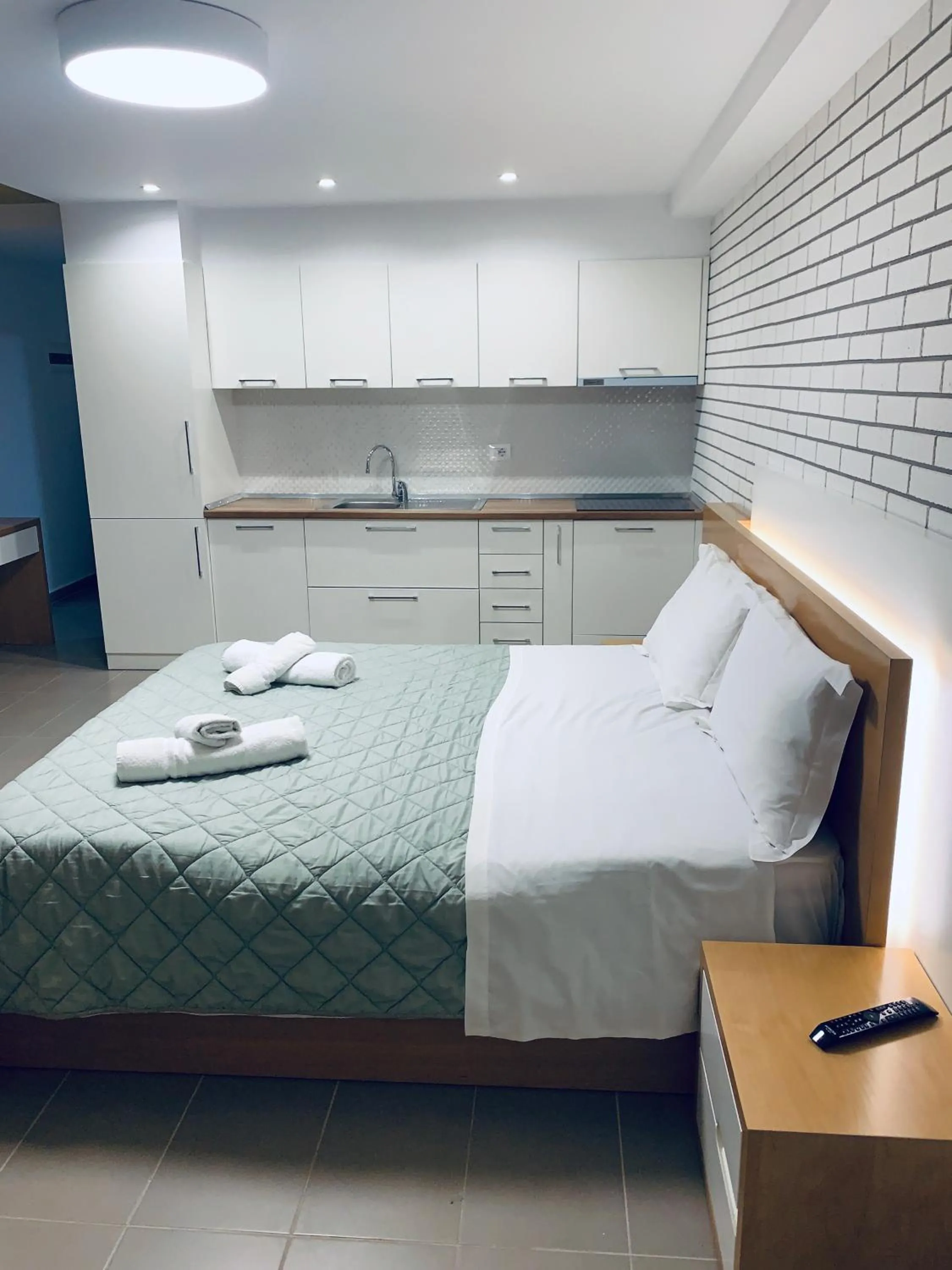 Bed in Sunrise Luxury Apartments