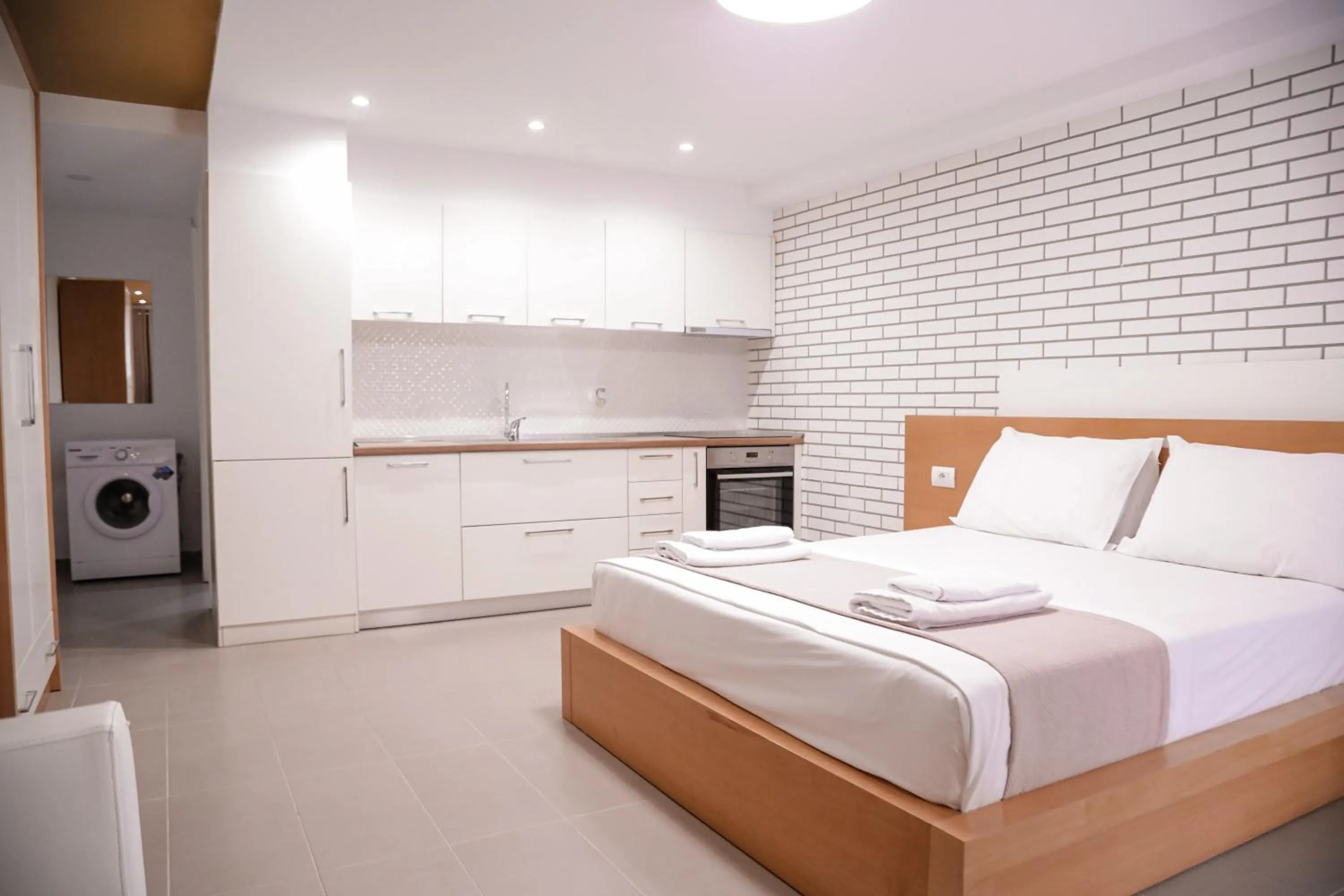 Bed in Sunrise Luxury Apartments