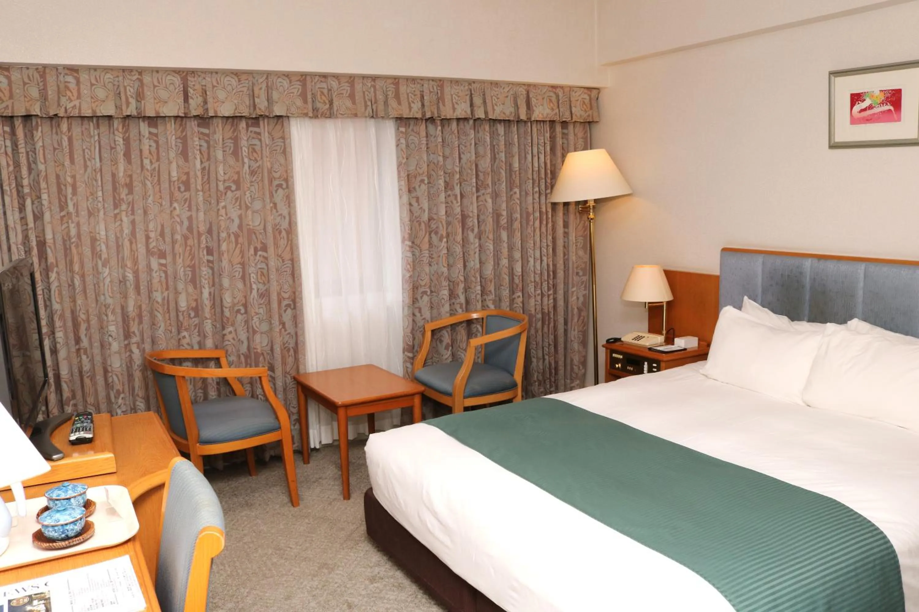 Bed in Hotel New Otani Tottori