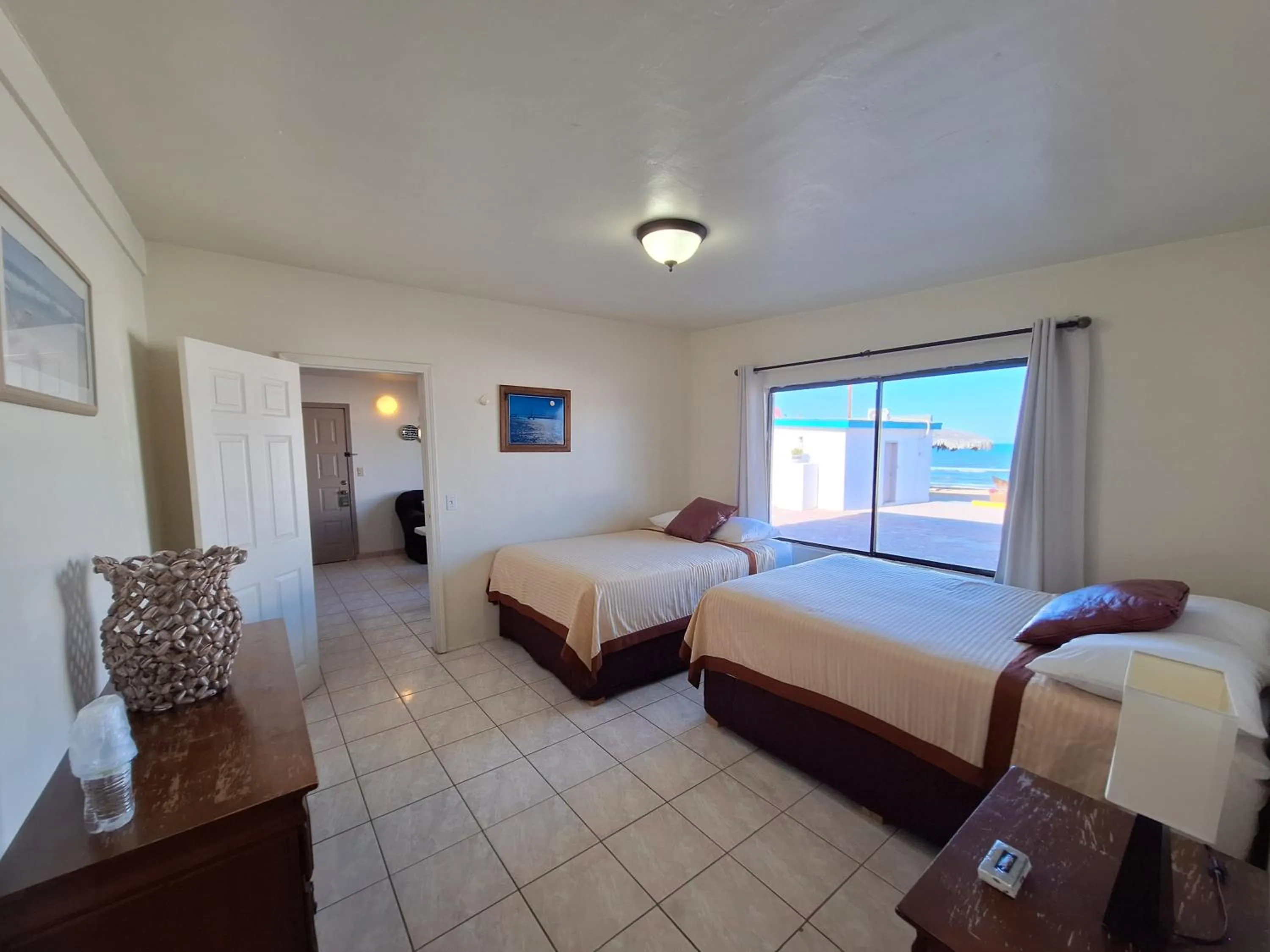 Bed in #55 Suite Bungalow Seaside Hotel & Victors RV Park