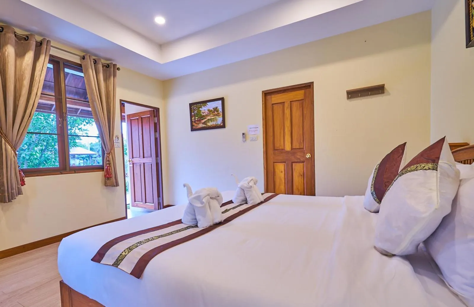 Bed in Mina Garden Villa Resort