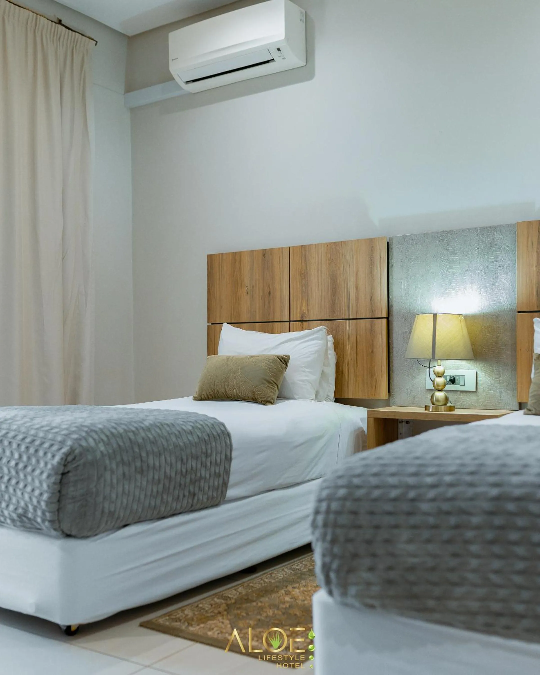 Bed in Aloe Lifestyle Hotel