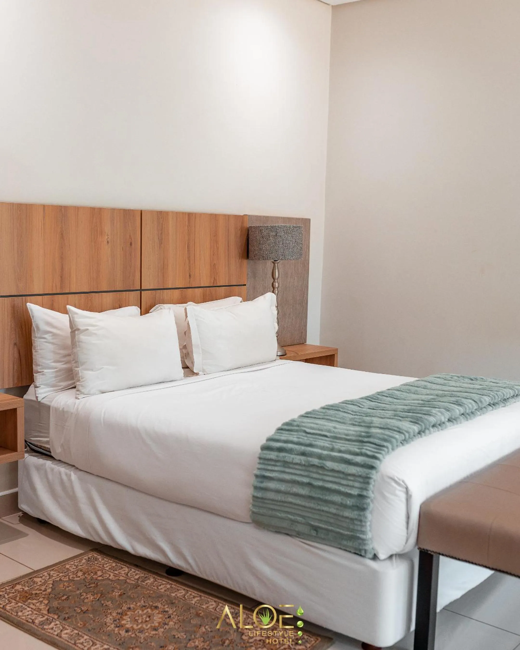 Bed in Aloe Lifestyle Hotel
