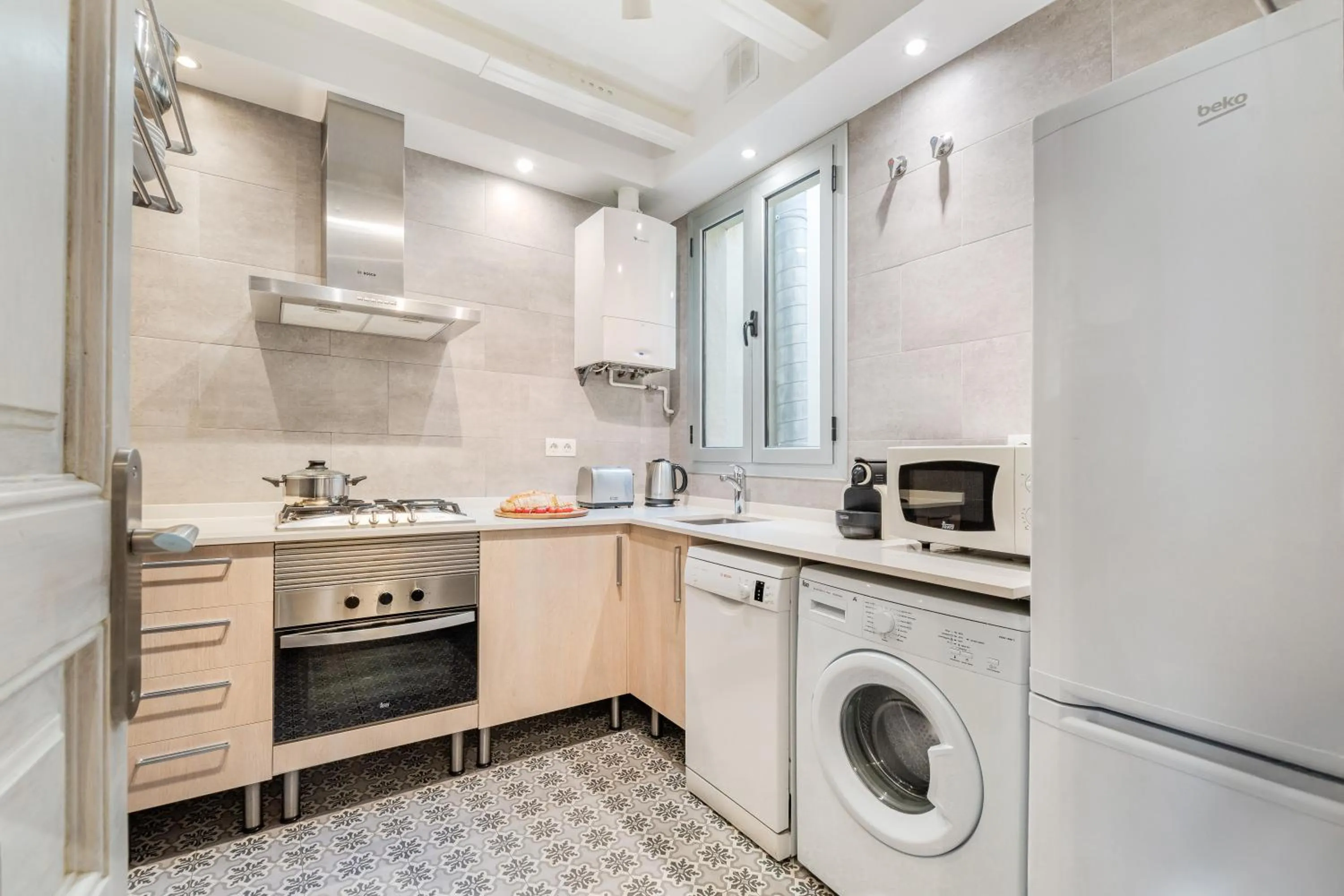 Kitchen or kitchenette in Fuster Apartments by Aspasios