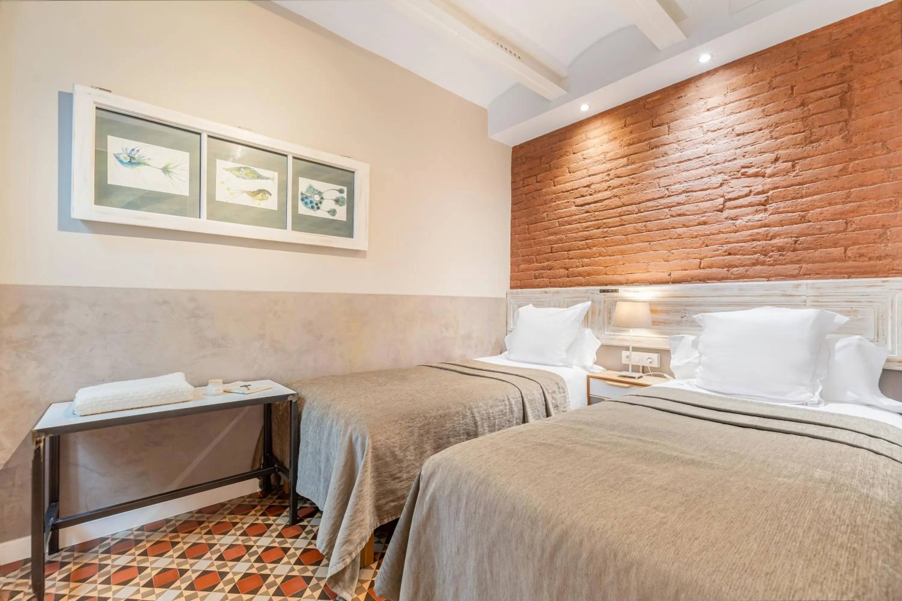 Bed in Fuster Apartments by Aspasios