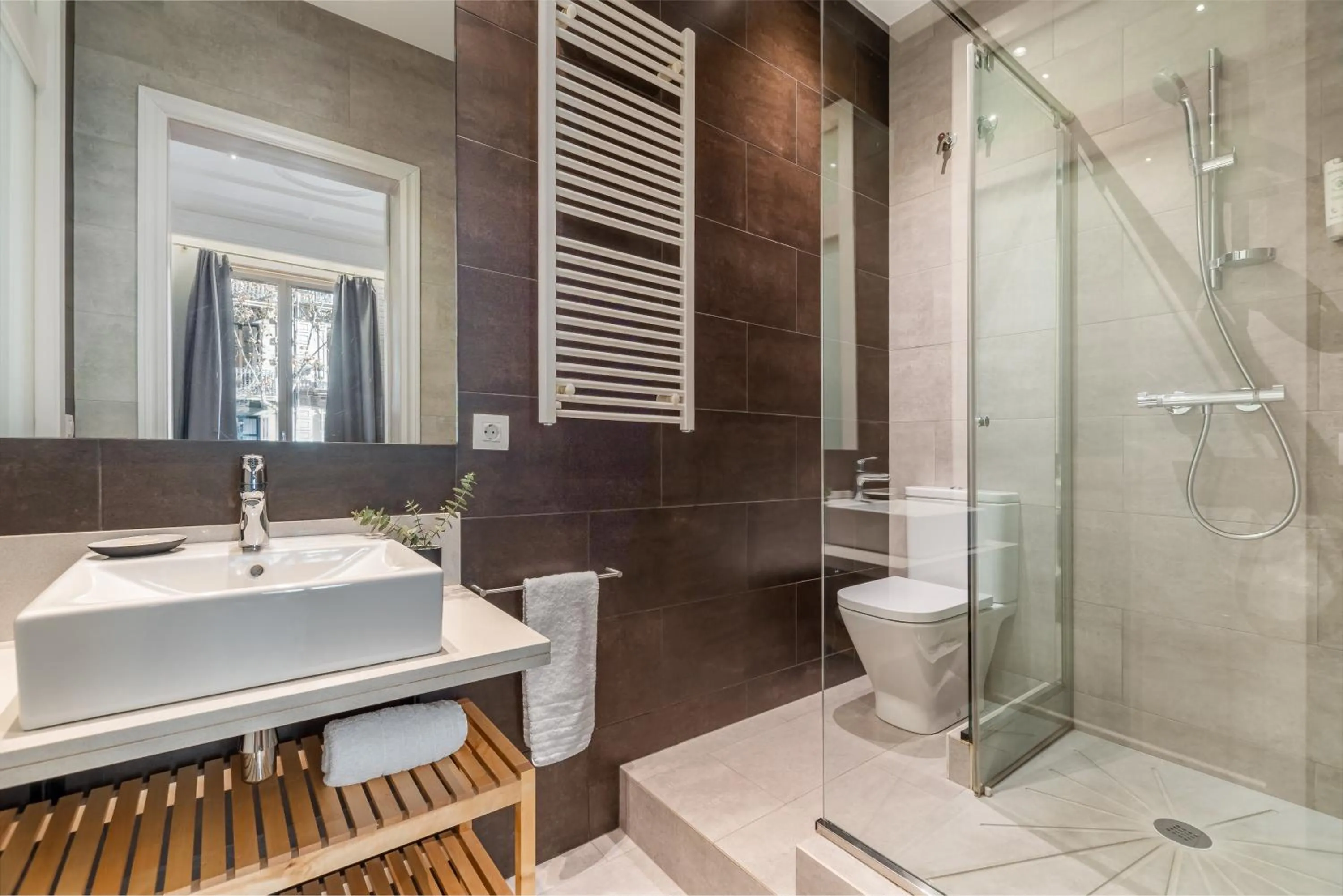 Shower in Fuster Apartments by Aspasios