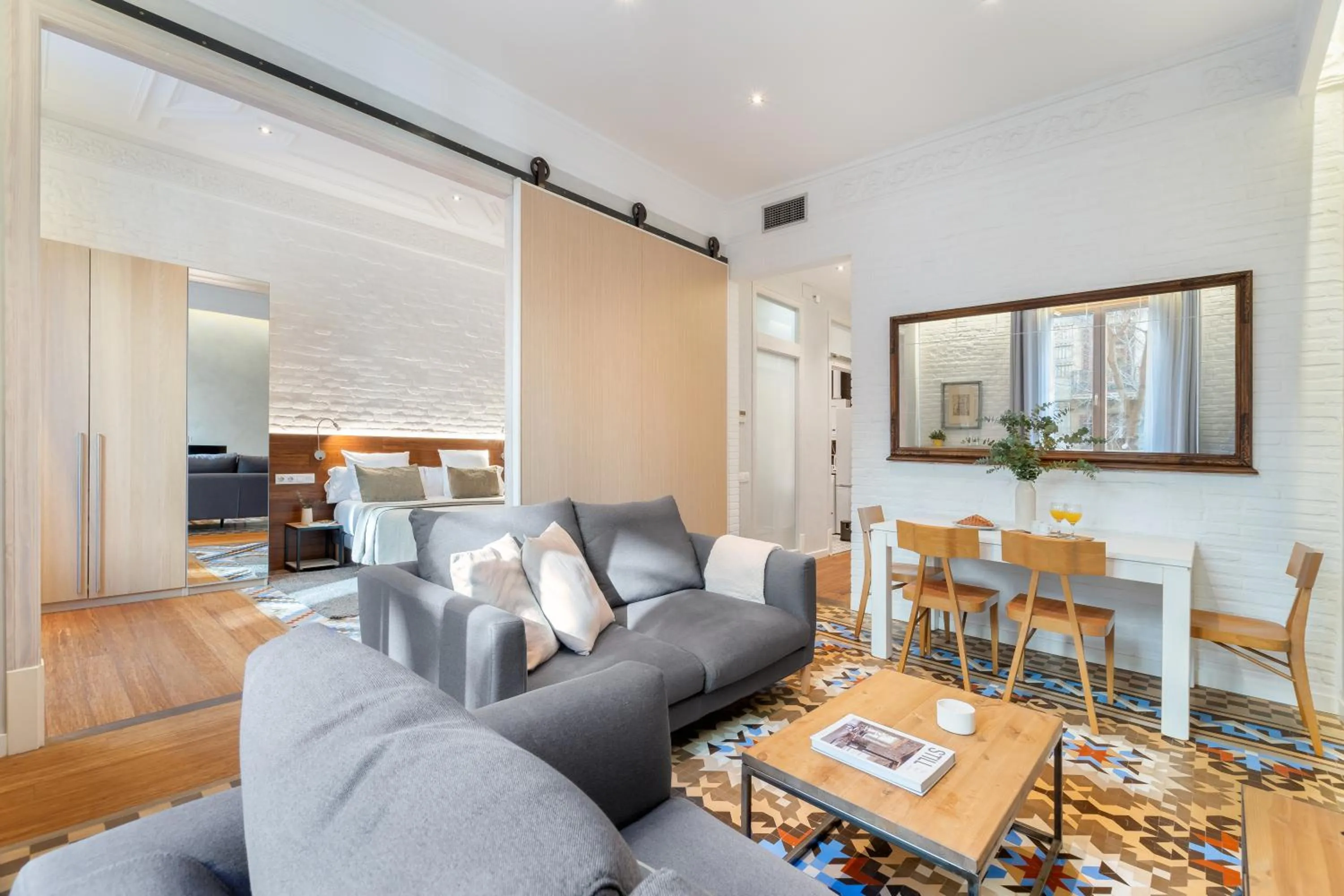 Living room in Fuster Apartments by Aspasios