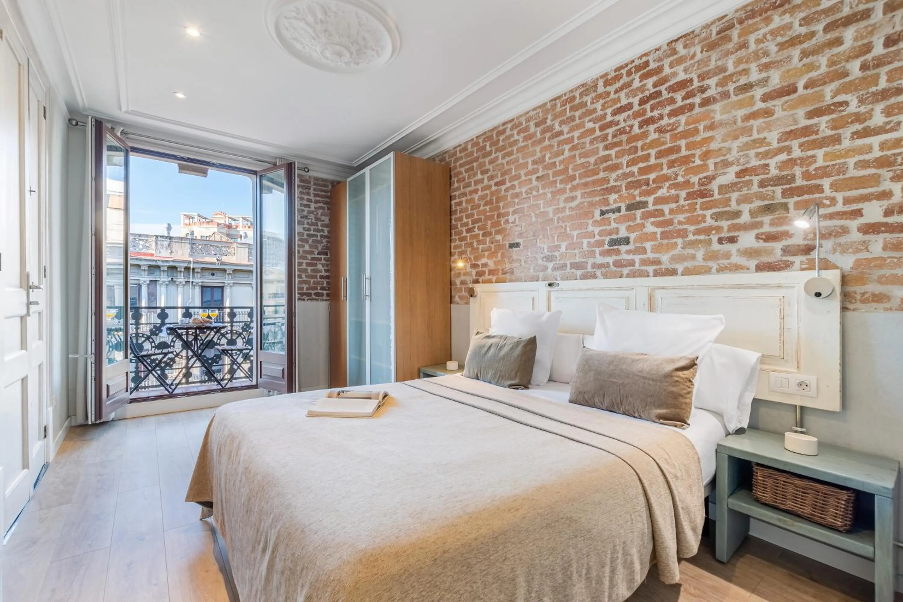 Bed in Fuster Apartments by Aspasios