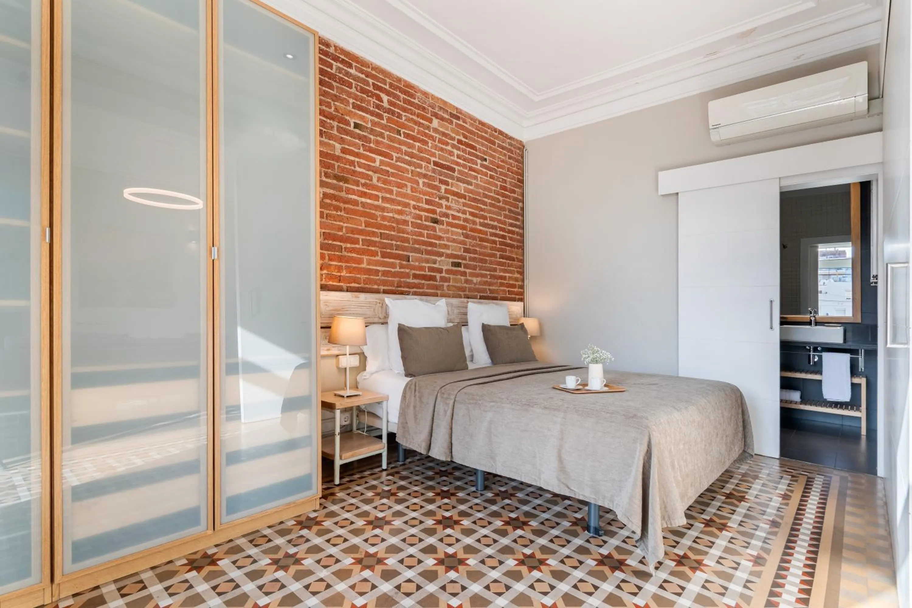 Bed in Fuster Apartments by Aspasios