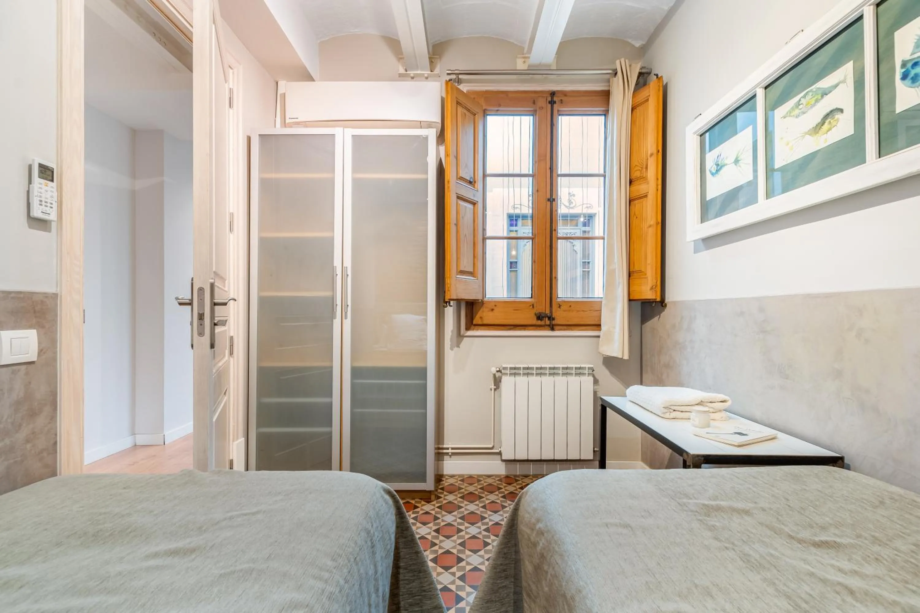 Bed in Fuster Apartments by Aspasios