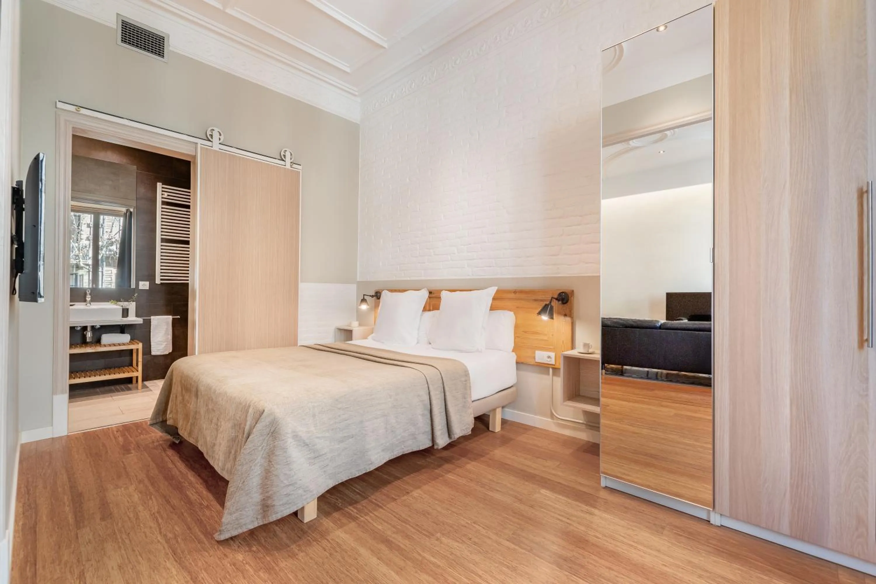 Bed in Fuster Apartments by Aspasios