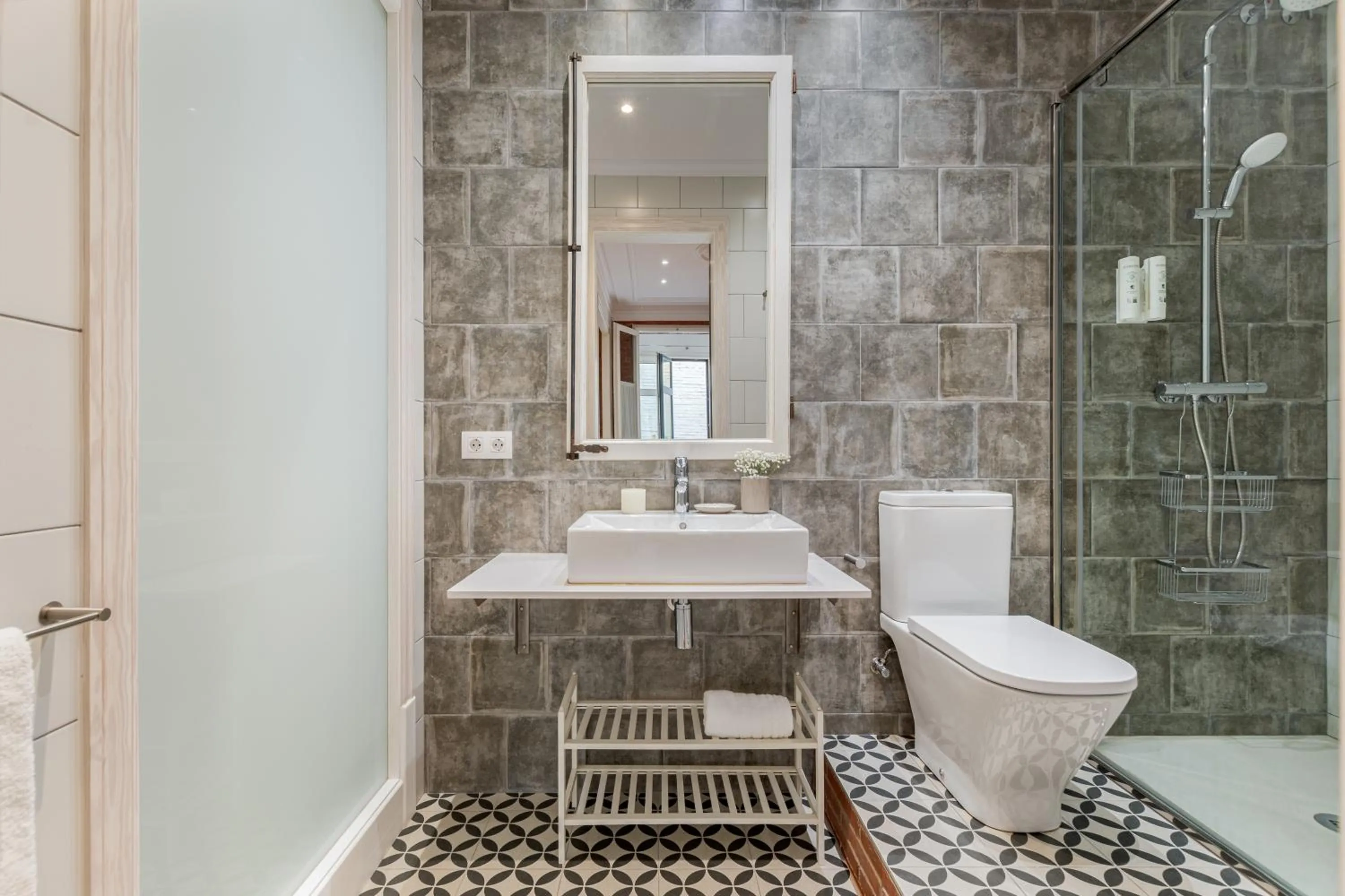 Shower in Fuster Apartments by Aspasios