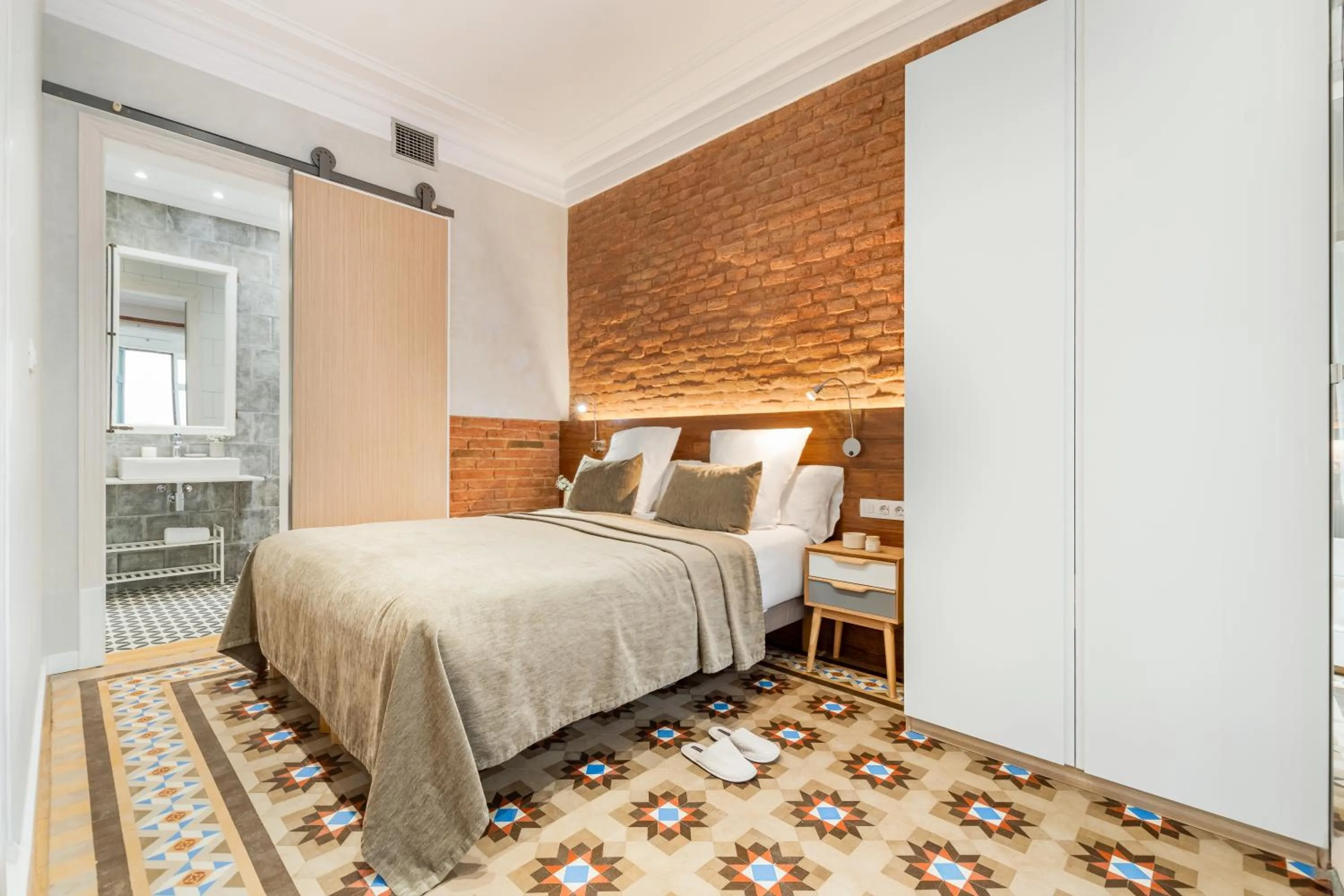 Bed in Fuster Apartments by Aspasios