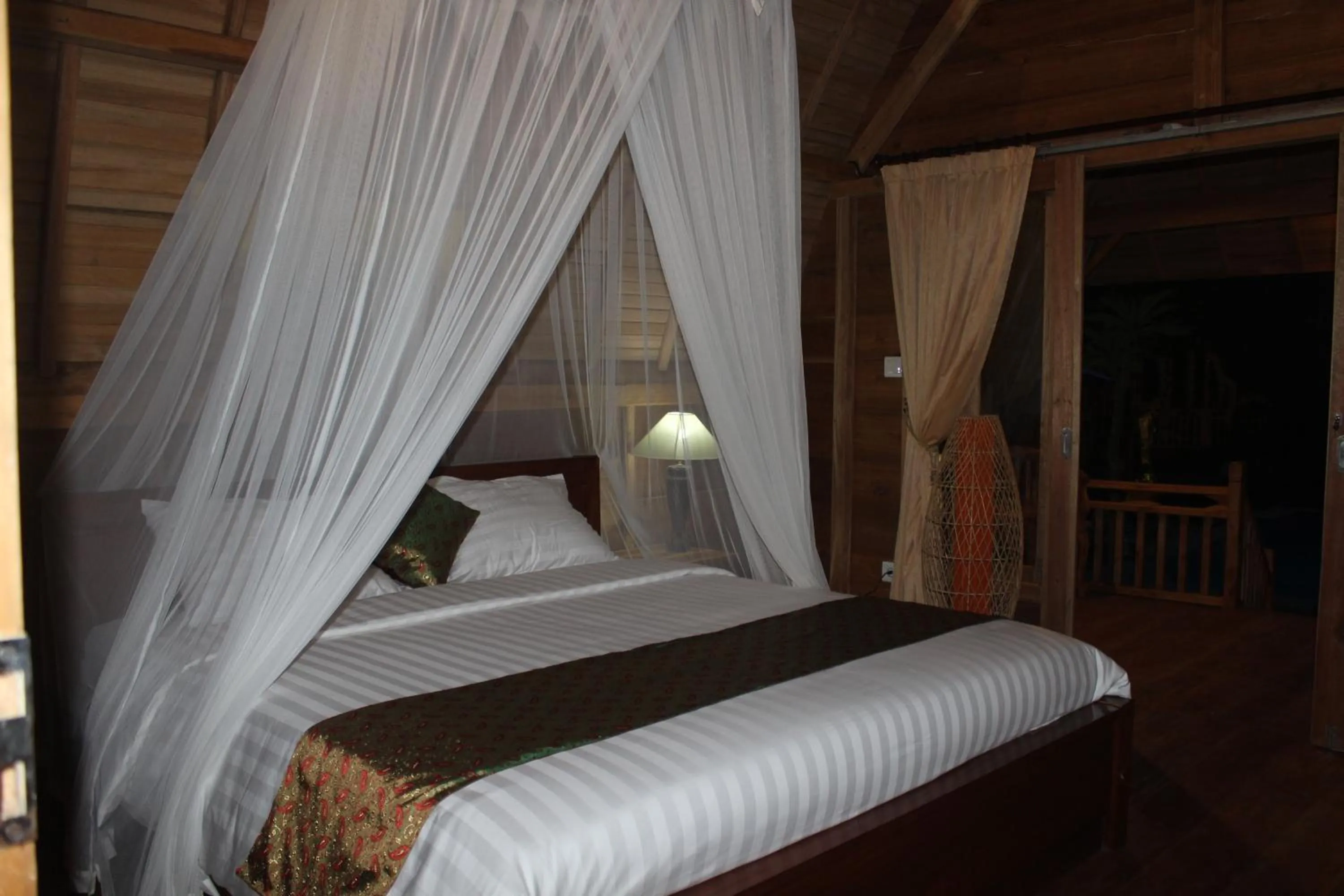 Bed in Halumba Eco Villa Bali