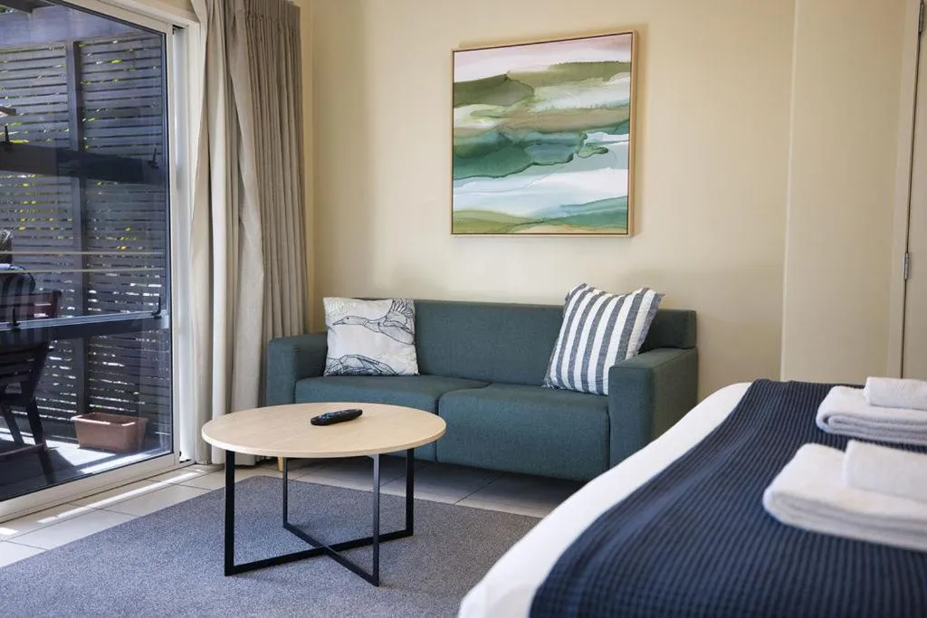 Living room, Bed in Tasman Holiday Parks - Papamoa Beach