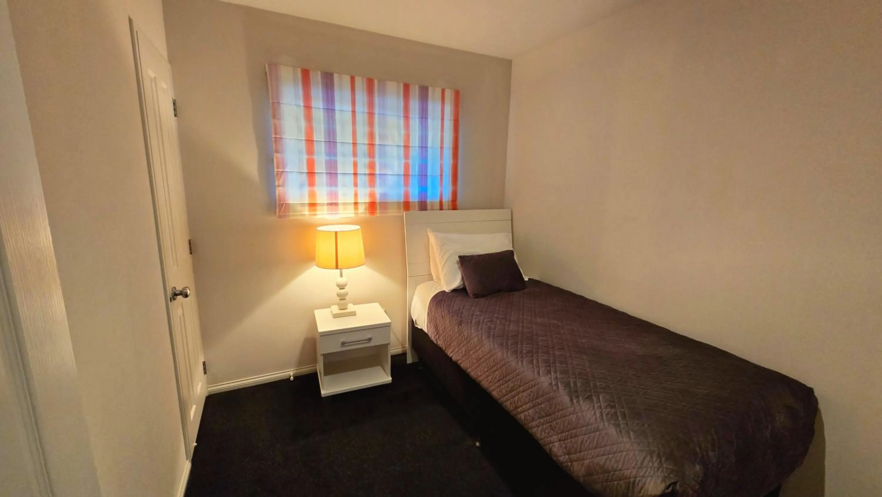 Bed in Carramar Motor Inn