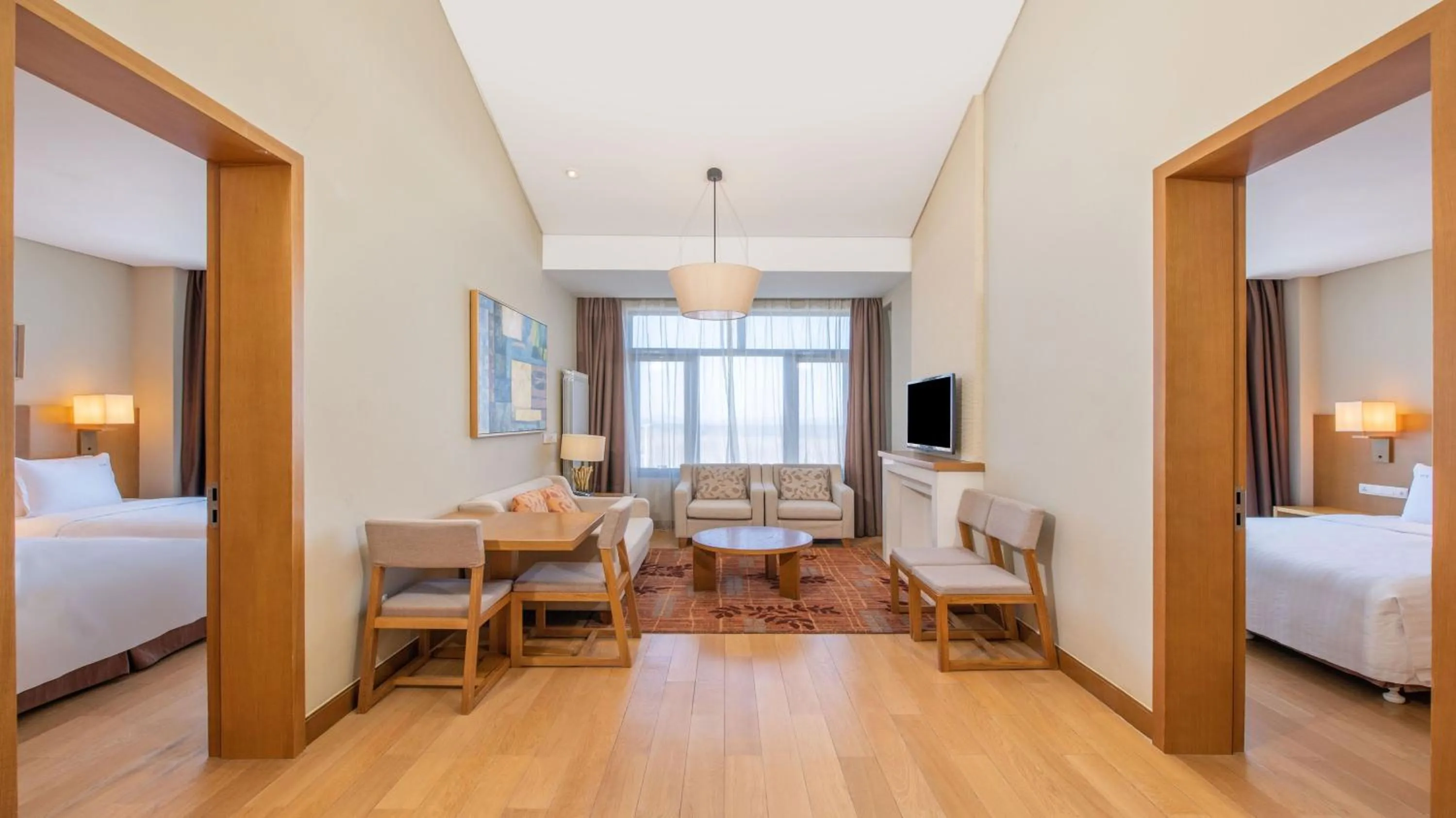 Photo of the whole room, Bed in Wanda Jin Suites Changbaishan