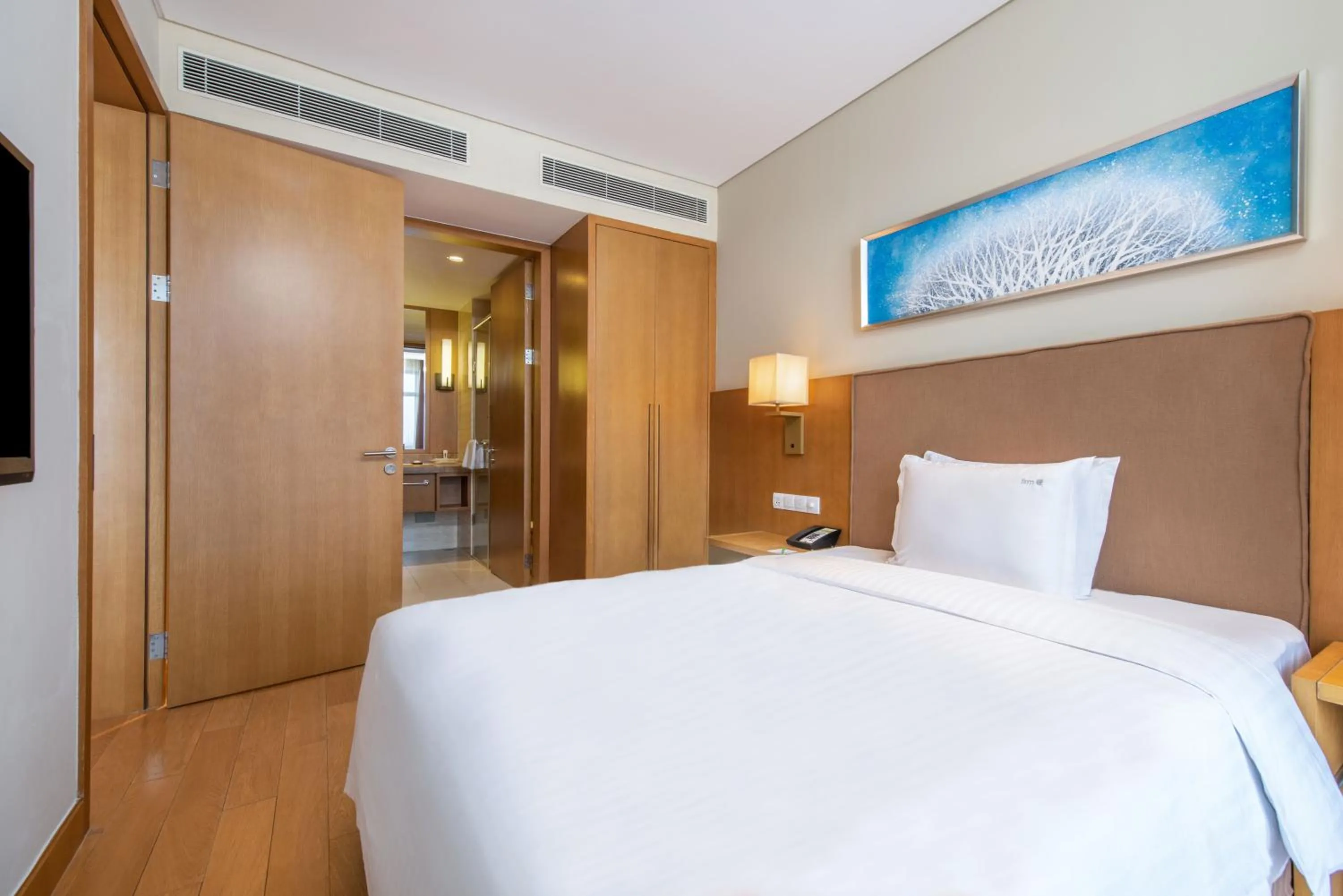 Bed in Wanda Jin Suites Changbaishan